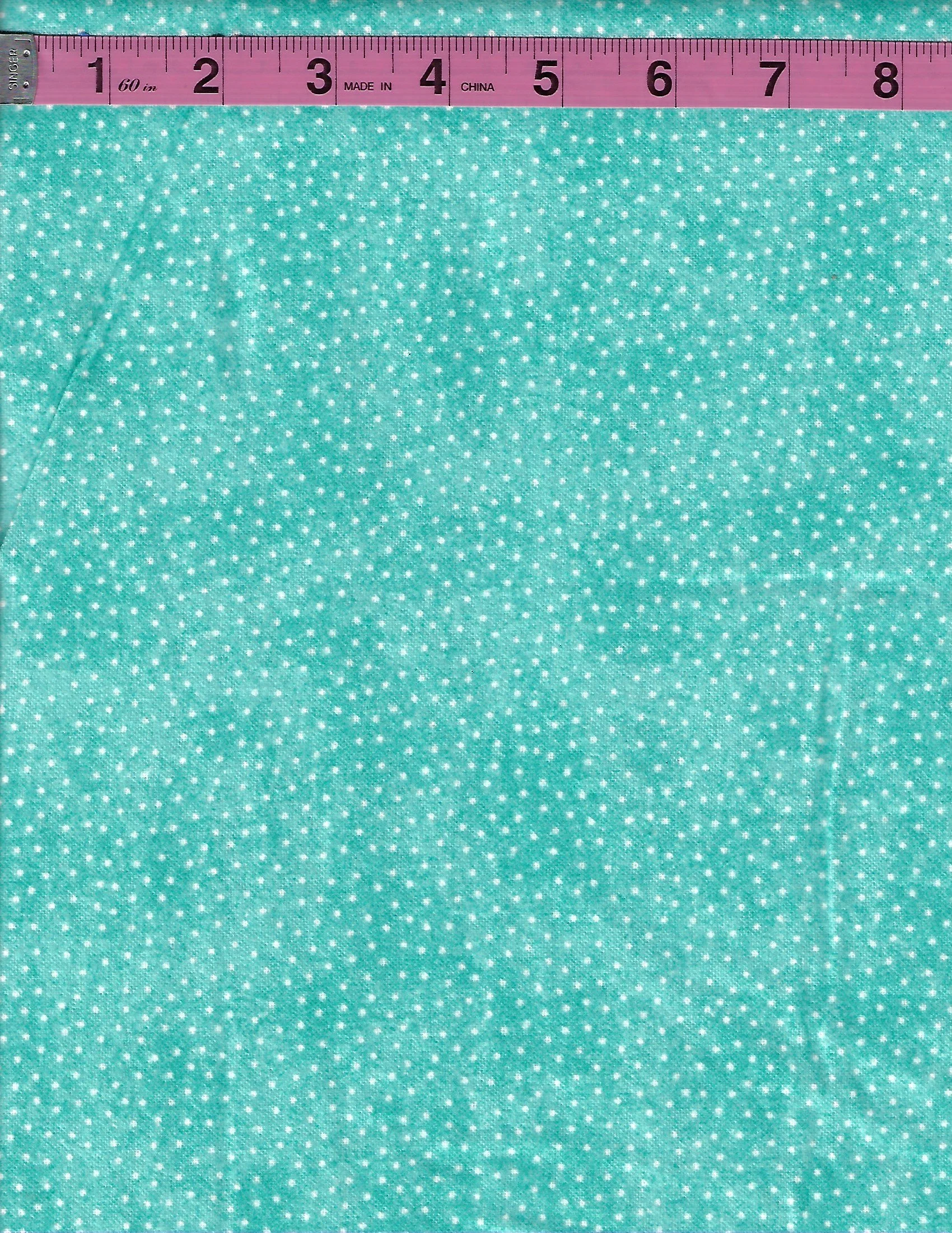 Turquoise cotton flannel fabric with an allover pattern of tiny white pindots