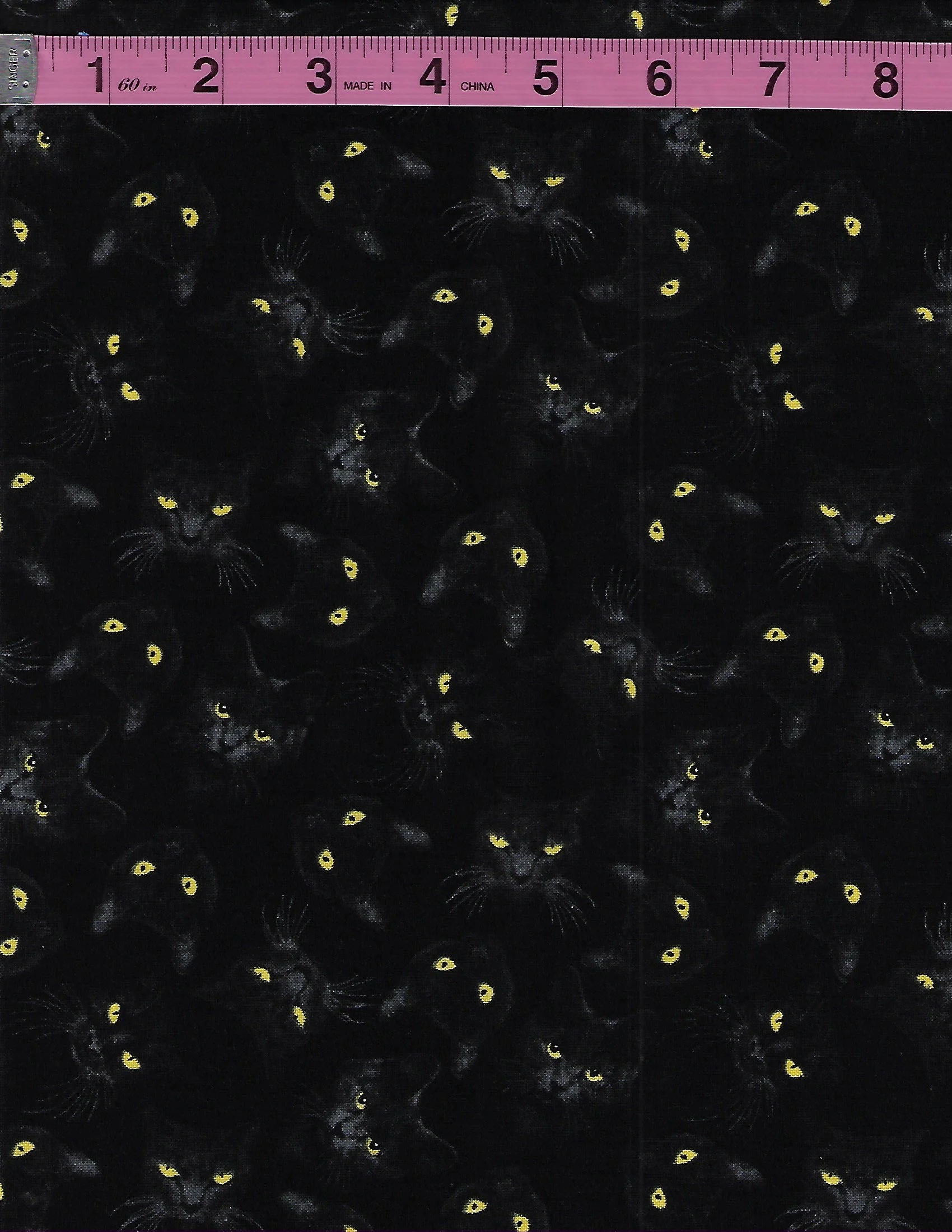 Halloween cotton fabrics featuring black cats on orange full moons and black cats with glowing yellow eyes