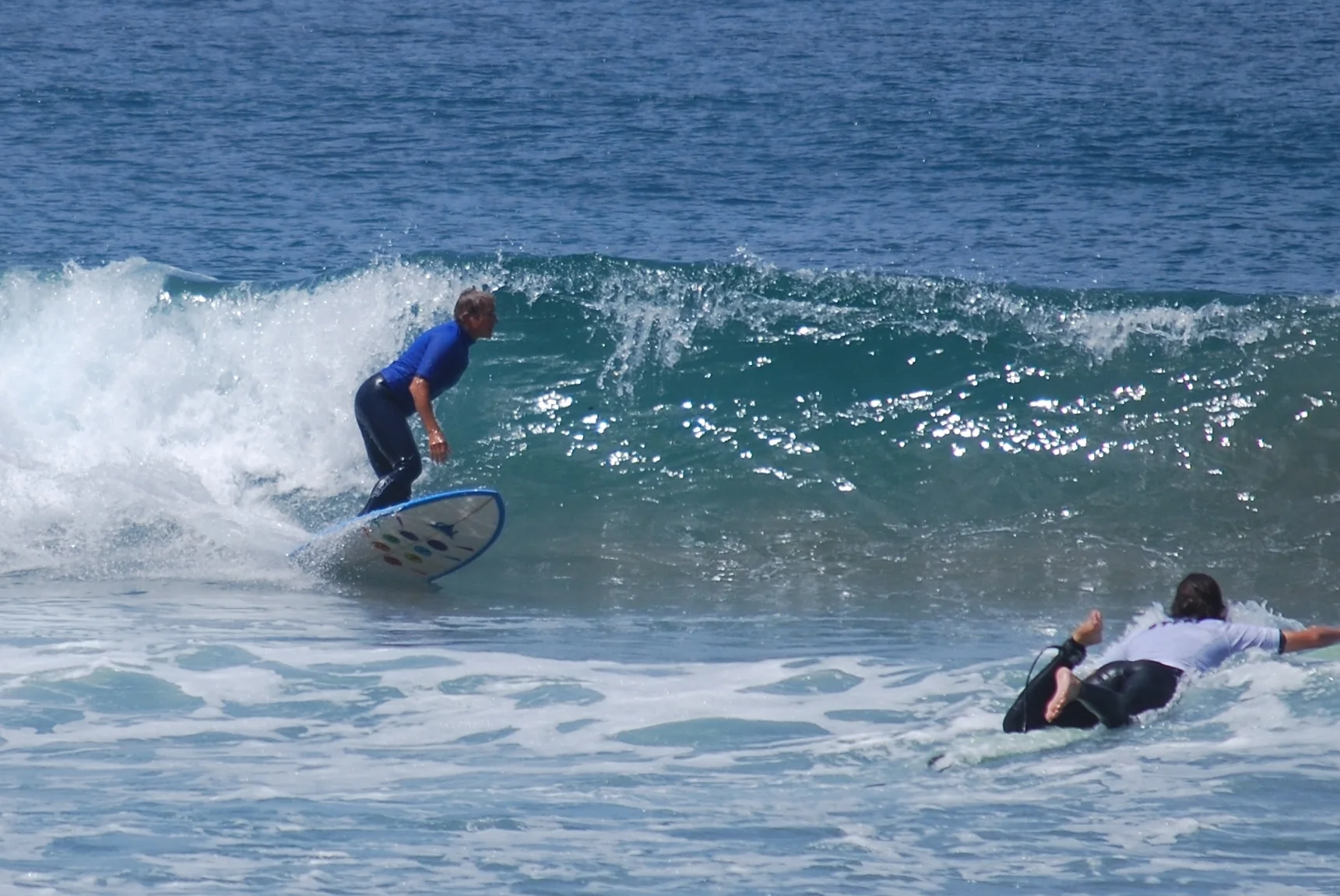Lori Malkoff, MD surfing in the annual Stone Steps contest finals 2013