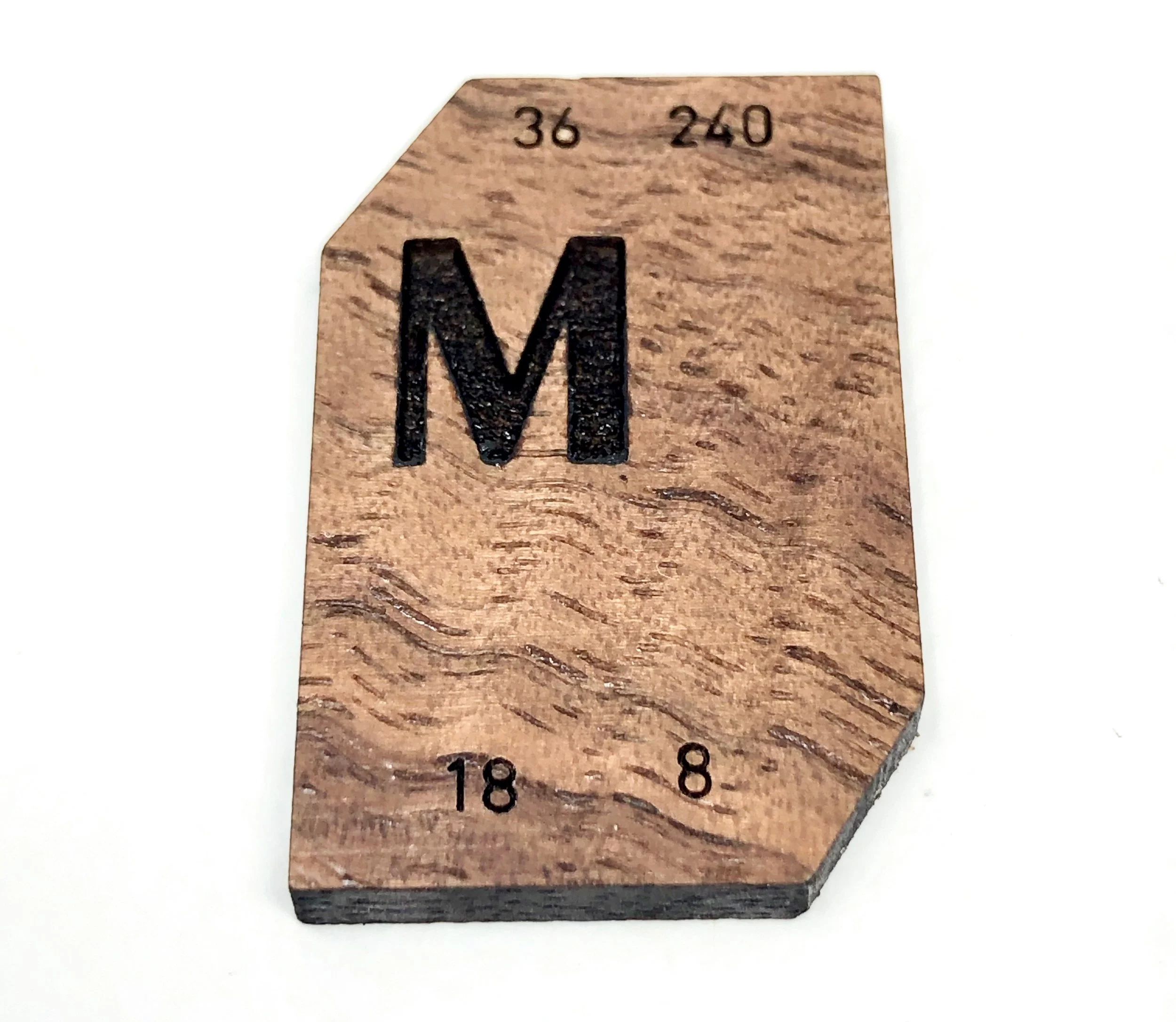 A wood laser-engraved version of a Monotype Electro Display Matrix