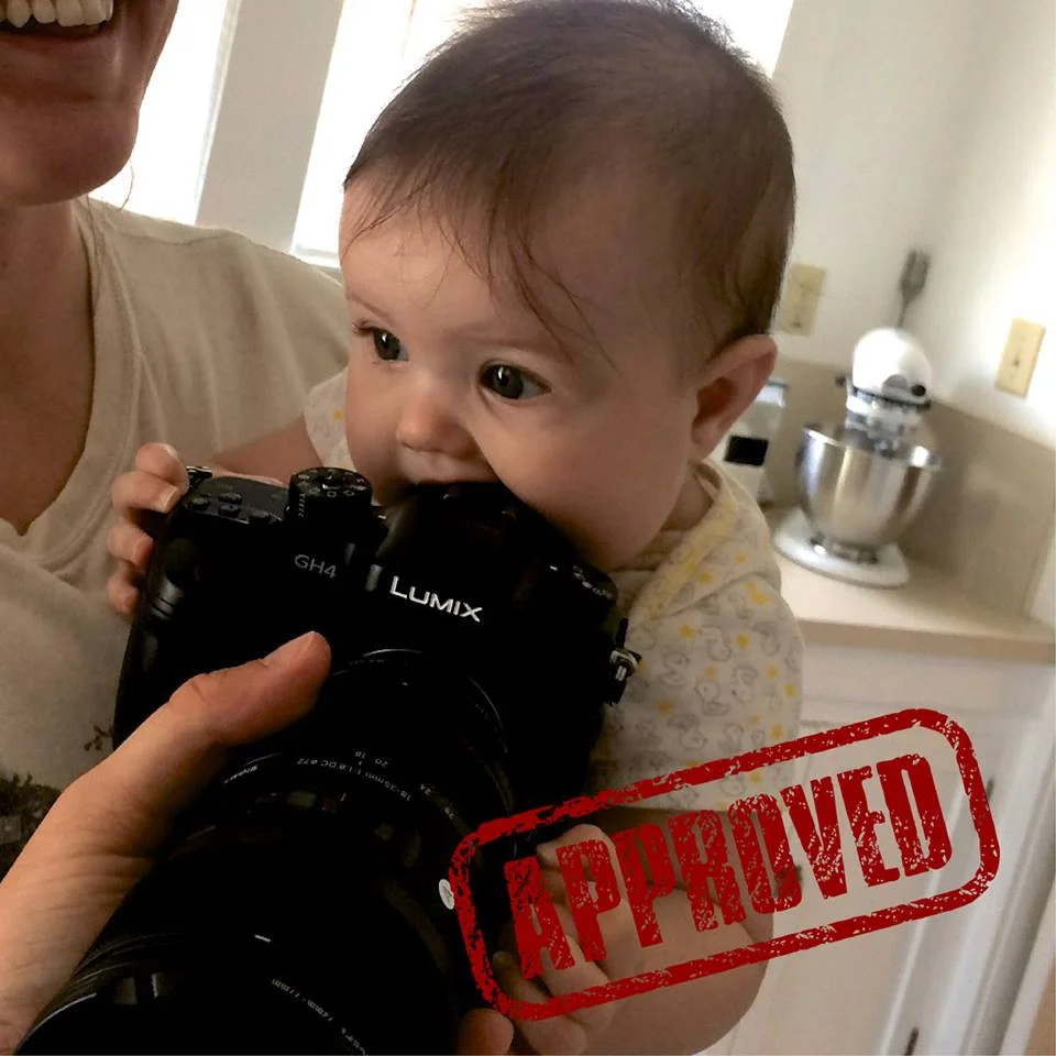 Unboxing the new GH4 camera with baby Avi - who promptly started chomping on it.