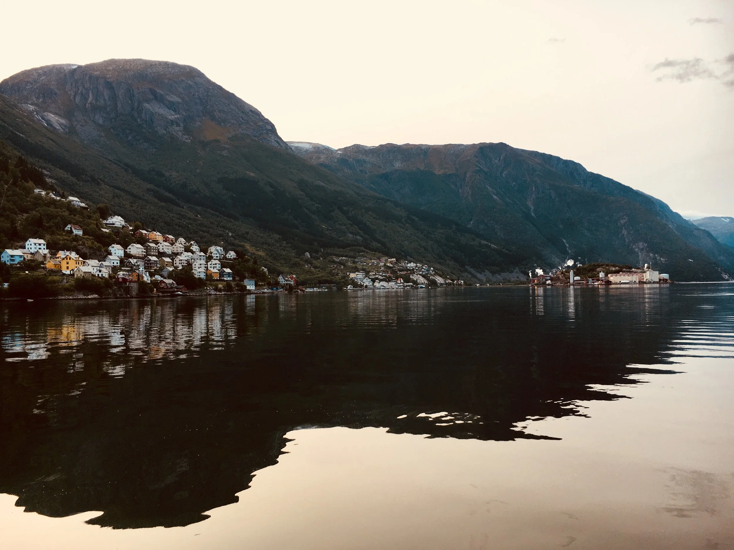 Sun setting in the evening in Odda, Norway.