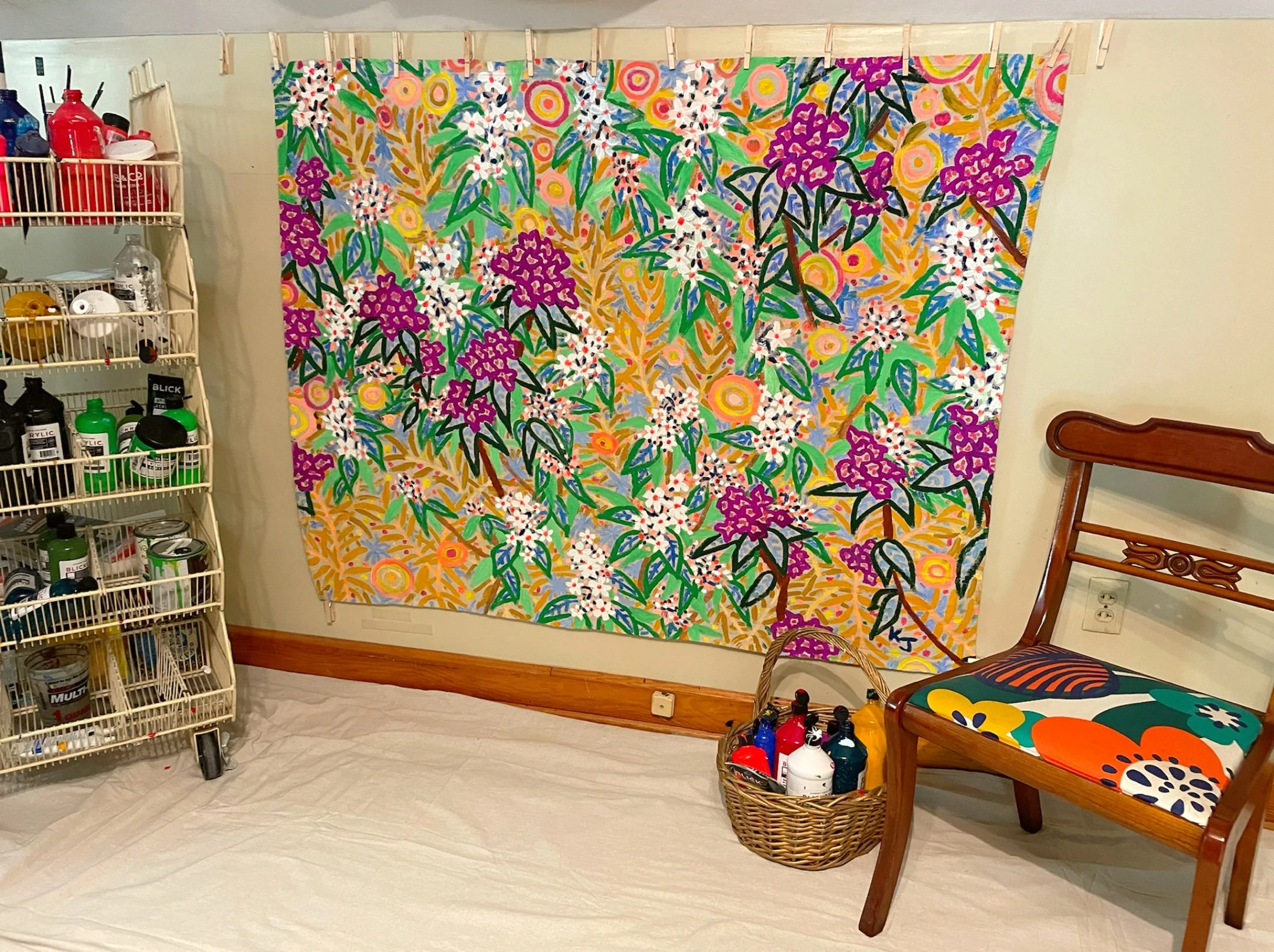 Affordable and vibrant floral painting on wall of art studio