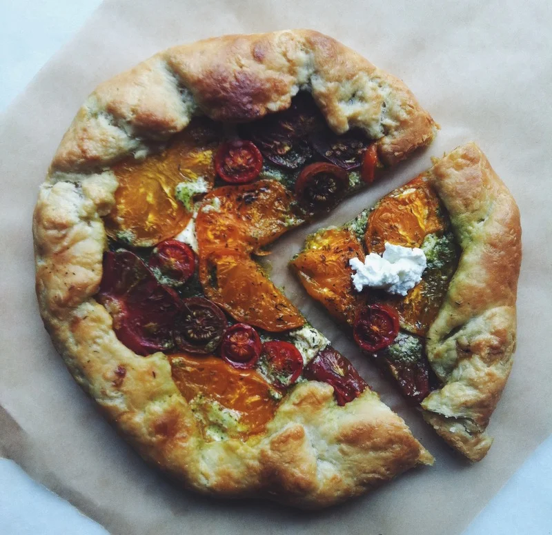 heirloom tomato galette with pesto + goat cheese
