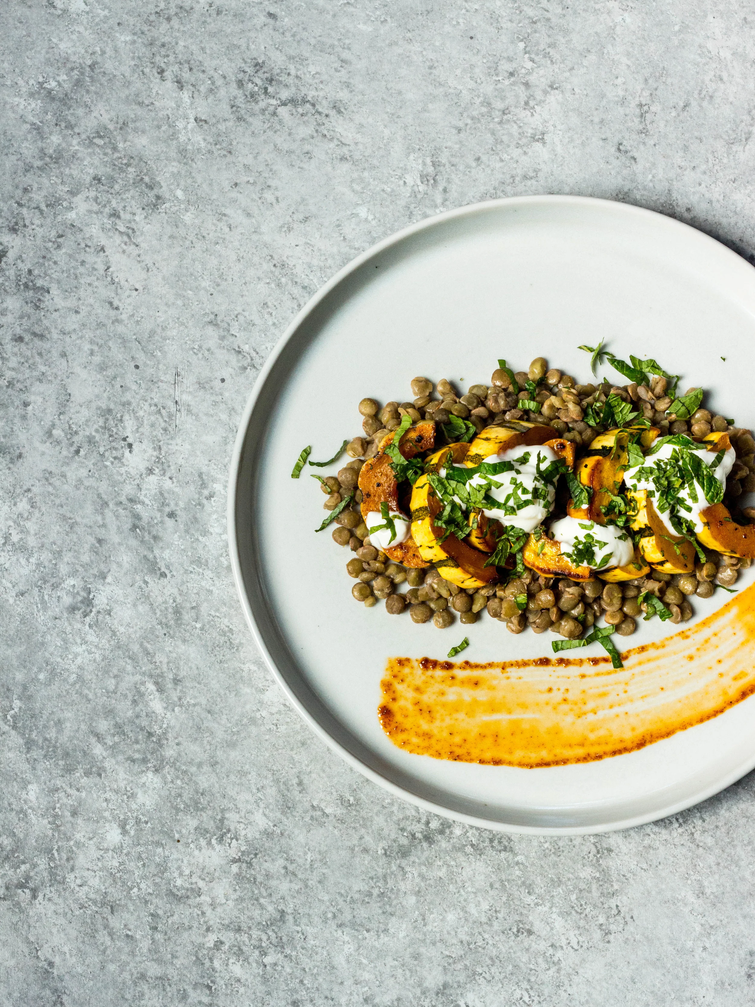 Harissa-Cumin Roasted Delicata Squash Over Lentils with Yogurt + Mint