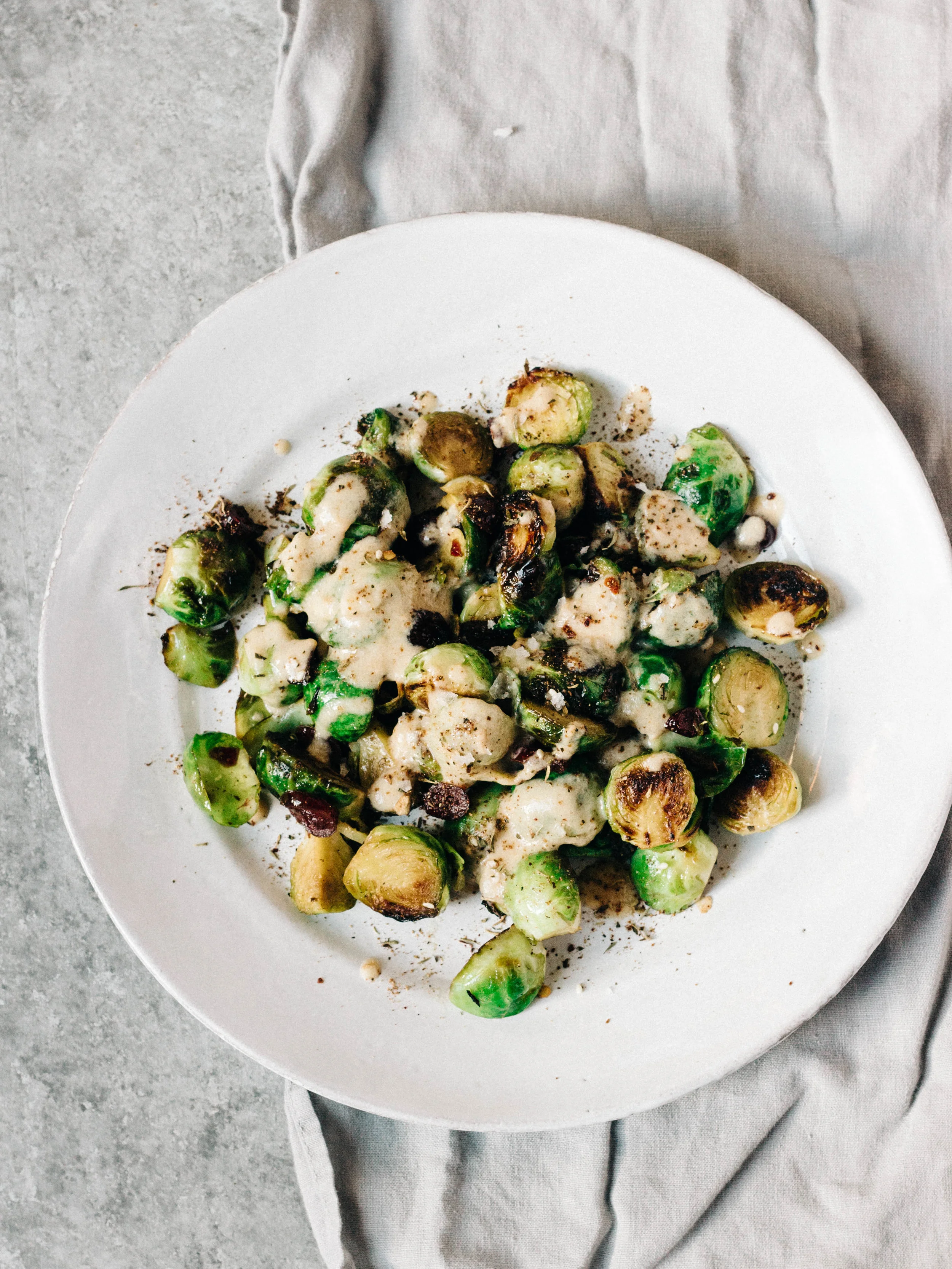 Roasted Brussels Sprouts with Cranberries, Tahini + Sumac
