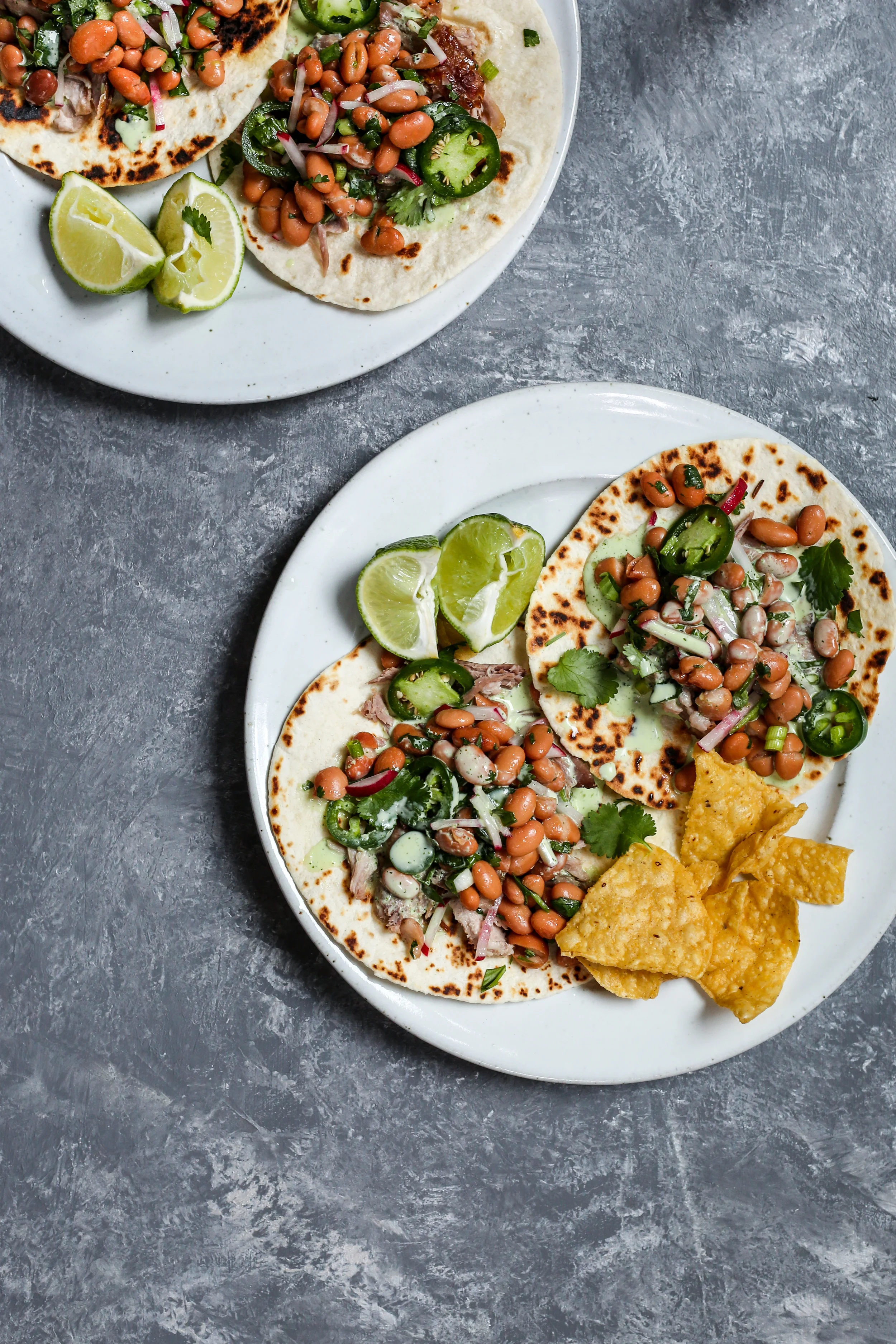 Pork Tacos with Pinto Bean Radish Salad + Cilantro Crema