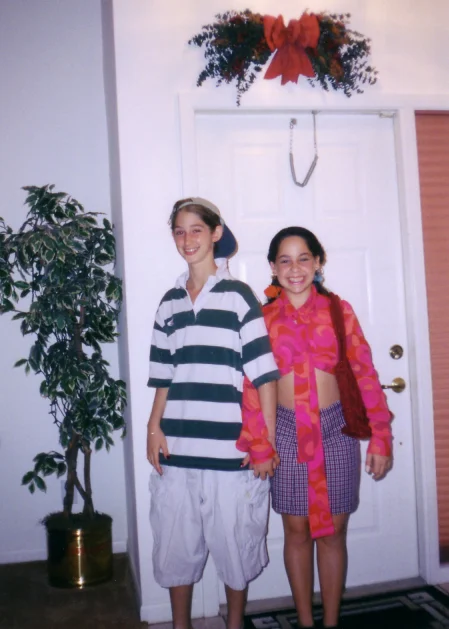 Me and a friend around age 10, dressed as a 'couple.' I'm wearing my step-brother's clothes.