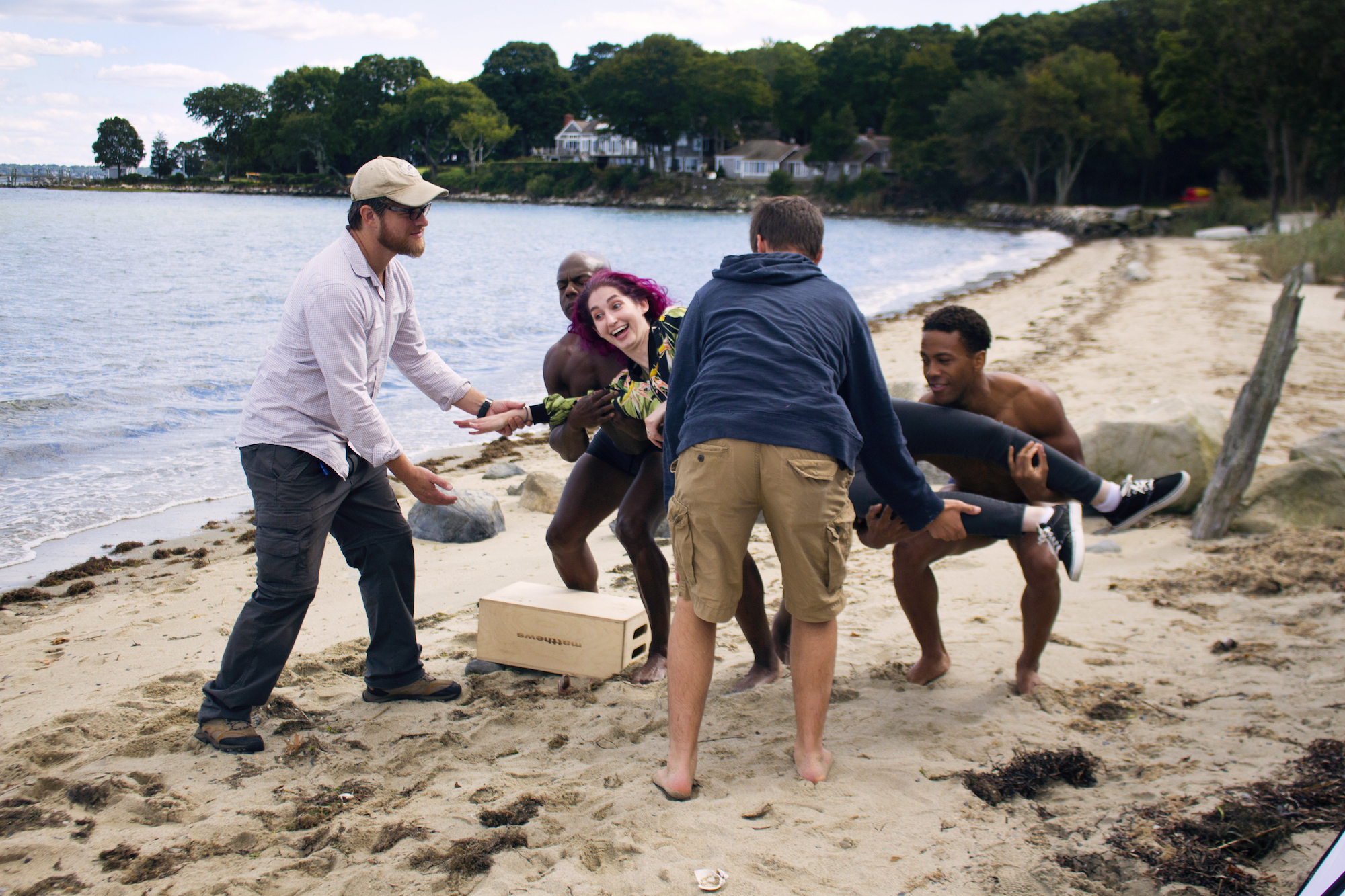 Unsure how to facilitate 'the lift,' grip/gaffer Dan Perez de la Garza helps Actors Kevin Peterson, Reggie Joseph and Sean Brown raise Geena Matuson for her new promo, on the set of her 'Fauxmercials' series filming through 2017.