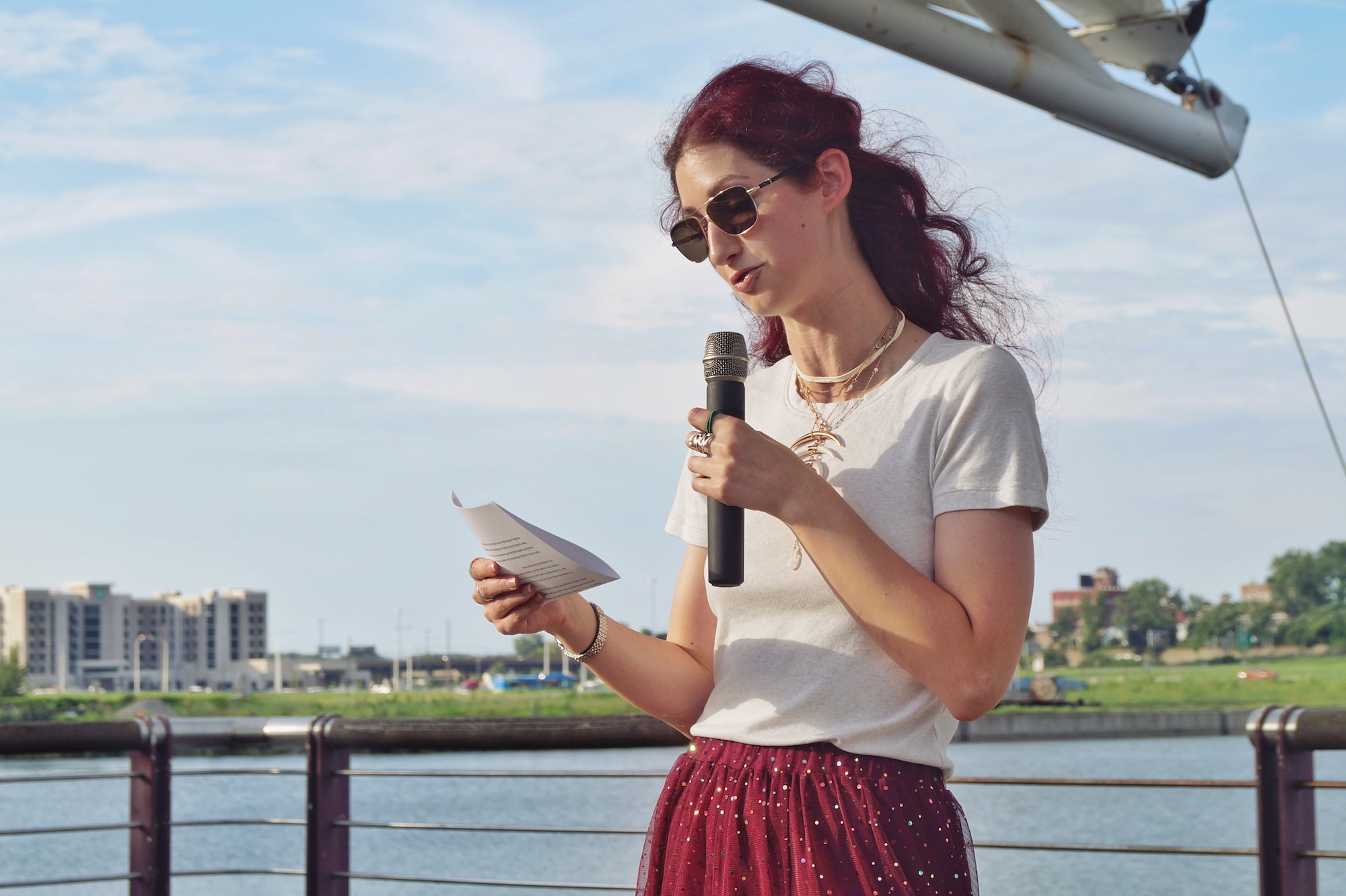 Geena Matuson (@geenamatuson) "The Girl Mirage" reads poem 'Indigo and the North' at Mouri Pour Viv "Open Mic Day Party" in Syracuse, August 2018. Photography by Sajida Ayyup.