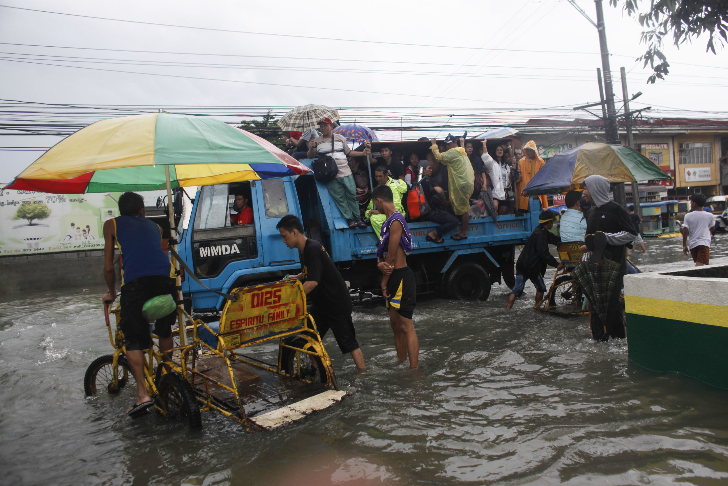  Residents begin to clean their homes submerged in floodwaters caused by monsoon rains in Sucat, Paranaque south of Metro Manila August 19, 2013. Heavy rain in the Philippine capital forced the closure of government offices, schools, banks and most p
