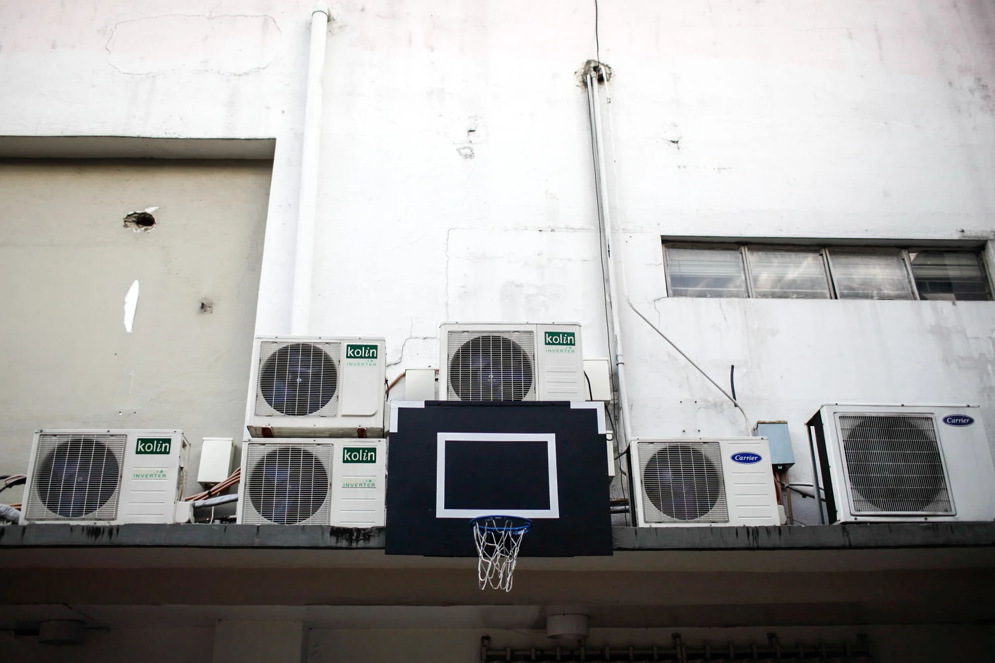  A makeshift basketball court located at an alley behind a corporate building in the financial district of Makati, Metro Manila Philippines. 