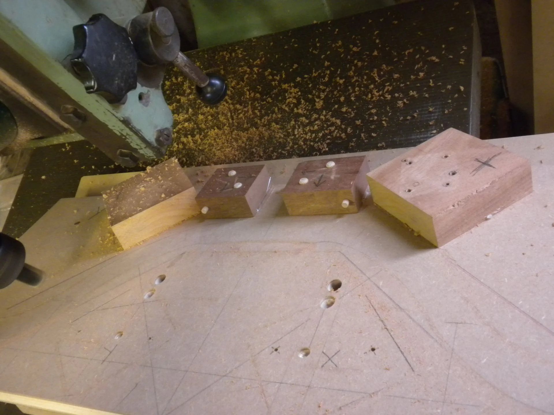   The same base jig from earlier with the dowels used to locate the crest rail in the same place for each cut.     