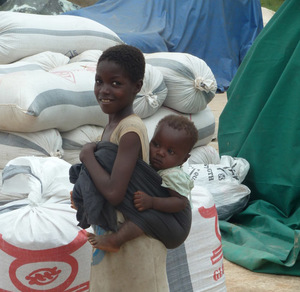 Children at a mill for locally produced rice near Tamale, Ghana. Photo credit: Elise Szabo
