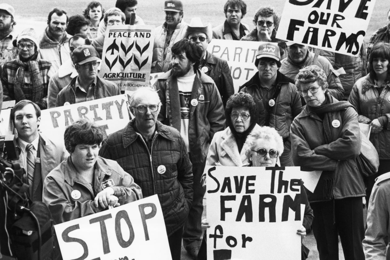 Farmers and supporters rally in 1983 in Iowa, seeking price supports for crops and a moratorium on farm foreclosures. PHOTO: BETTMANN ARCHIVE