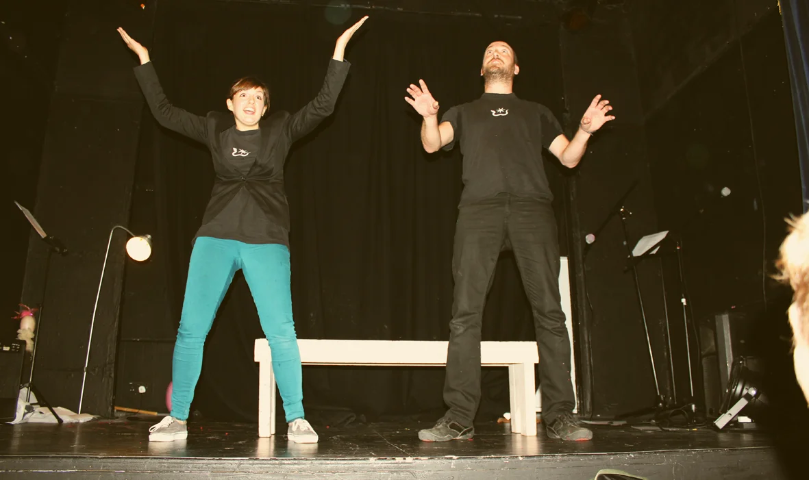 Soluble Business Solutions partners Valery and Valery (Annie Brooks & Ulysses Black) introduce the problem to the audience