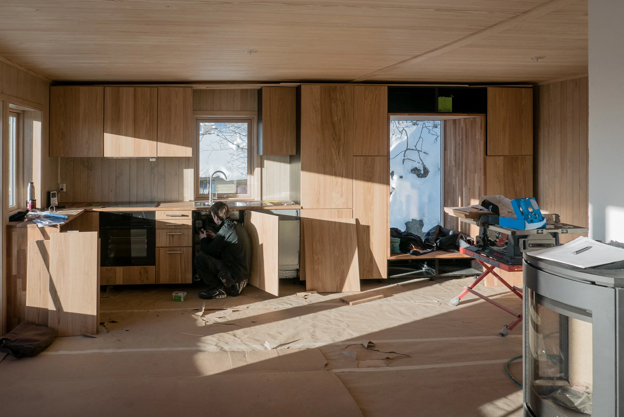 The new kitchen and storage wall being installed