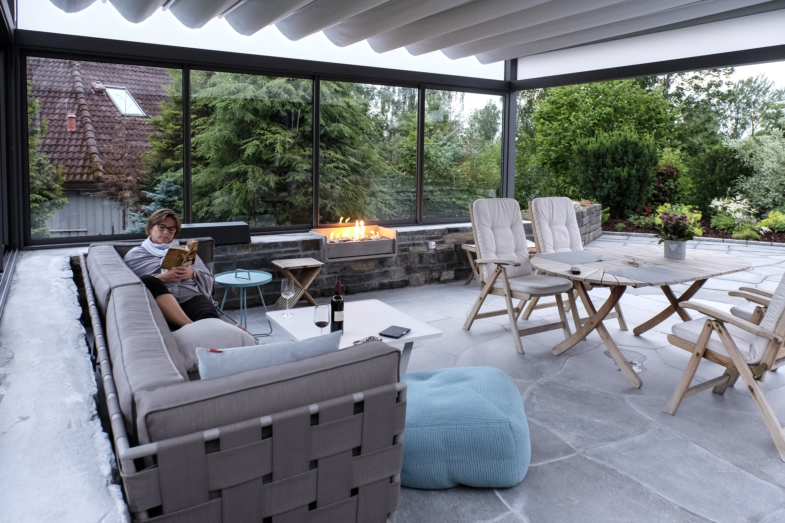 Our client, enjoying a late summer evening in the transformed terrace