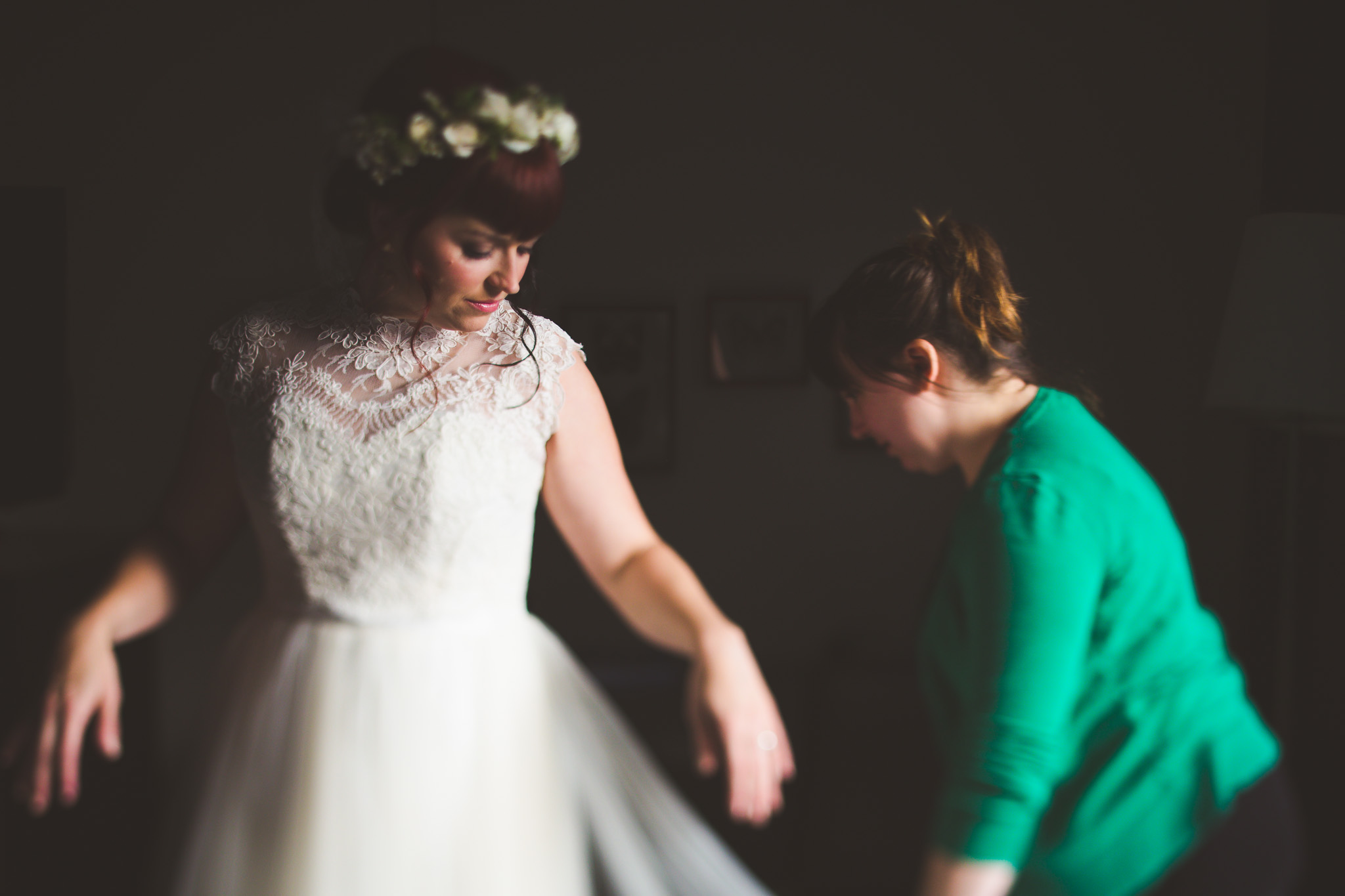 putting-on-wedding-dress-candid.jpg