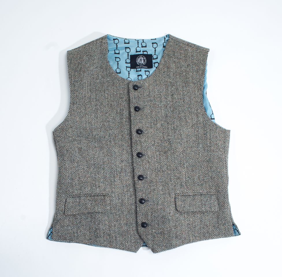 Round neck waistcoat in Harris Tweed with lucky seven leather hot cross bun buttons.