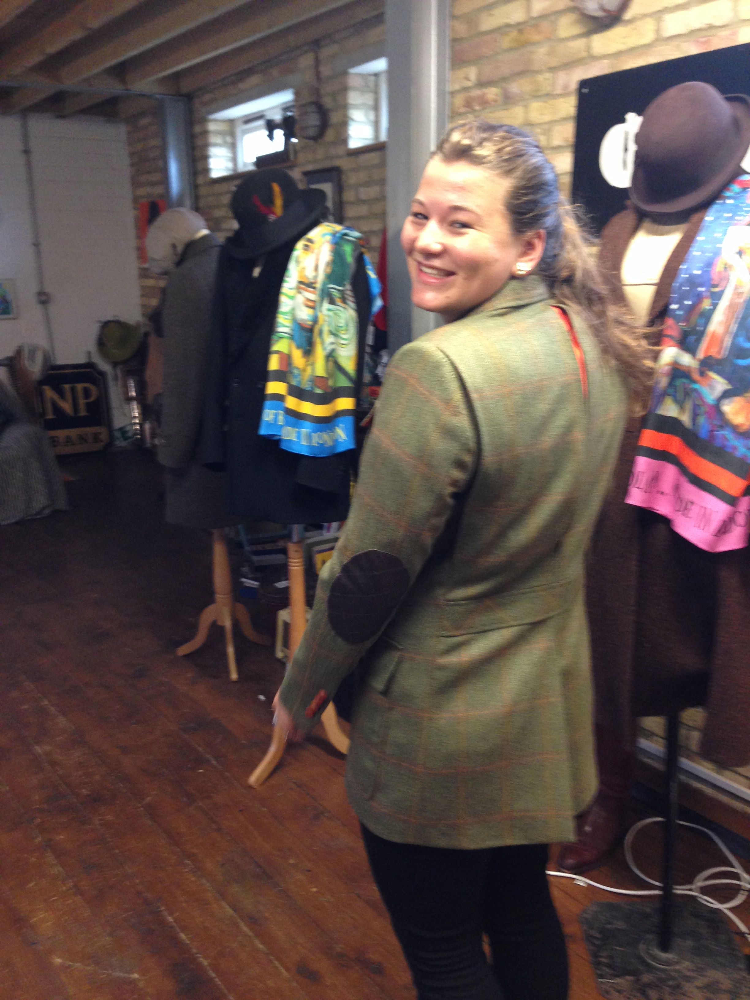 Sarah doing the over-the-shoulder red carpet pose in her shooting jacket. It is slashed doublet style centre back to show a flash of Dutch orange silk.