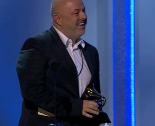 Scott with one HIS two Grammys at the 2014 ceremony. Bedlam- how success likes to dress!