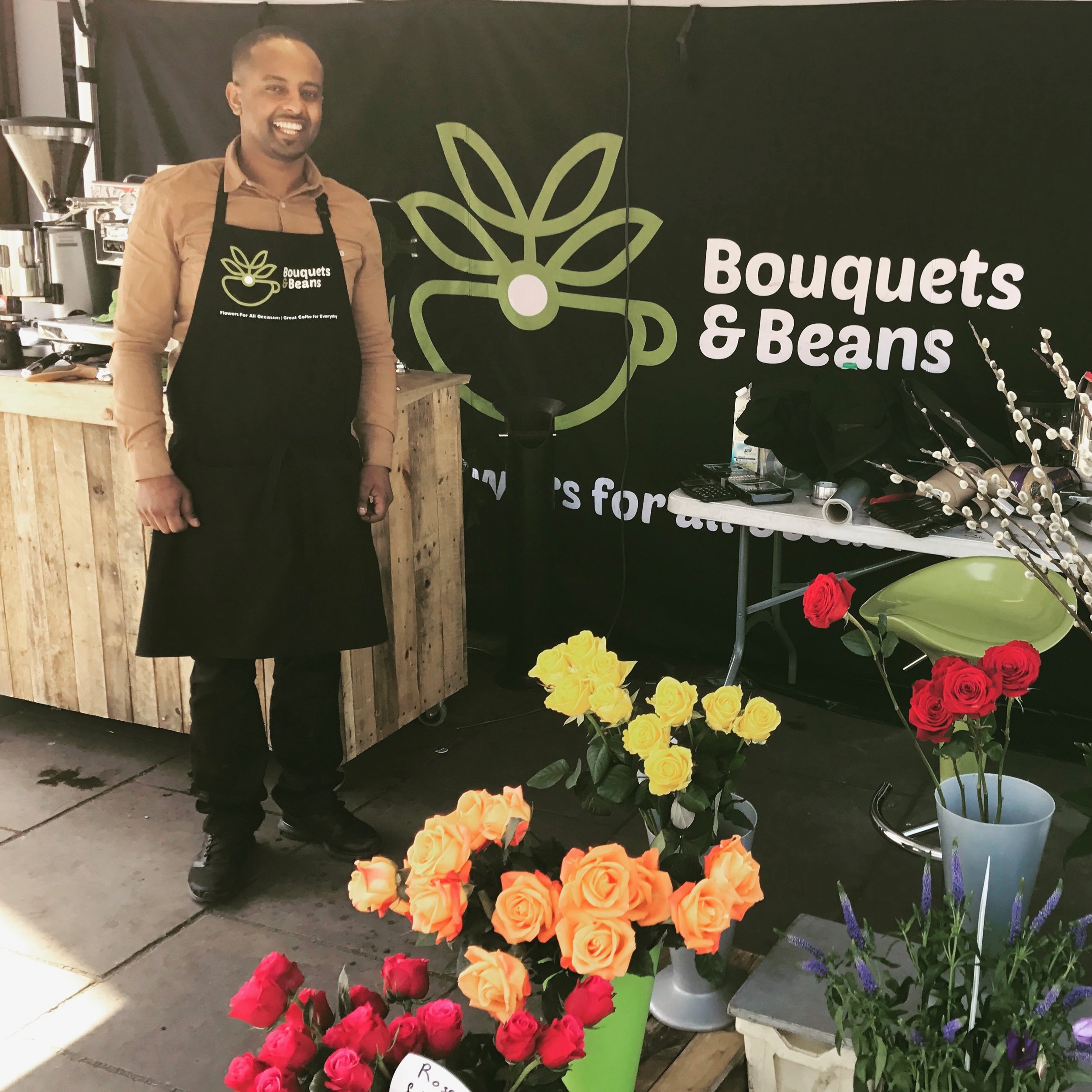 The man Abraham at Kennington Cross with the brew to make you bounce and the blooms to make you beam His apron by us