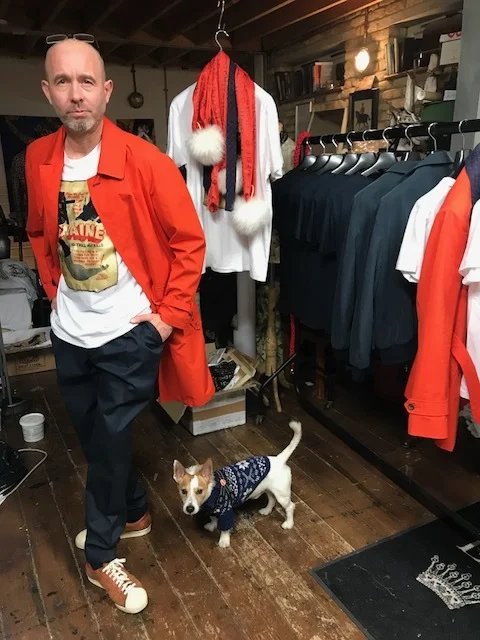 The waterproof blaze orange Ventile mac chimes with the navy cotton pegs