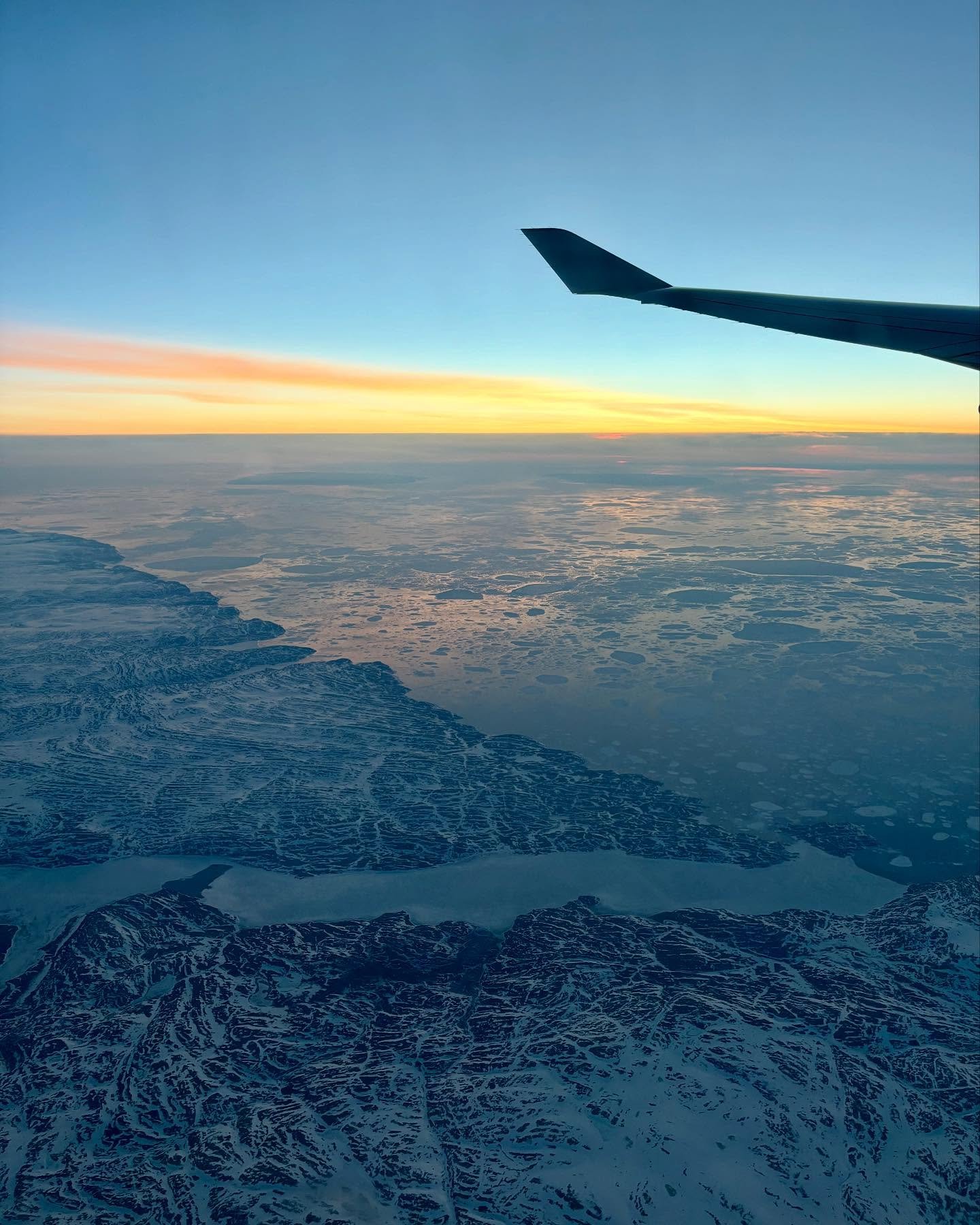 Flying over Nunavut, Hudson Bay, and the Northwestern Passages of Northeastern Canada was quite the experience! I watched the sun set and rise since it never really got dark, with hints of pastel colors on the icy land and frozen waters. I was mesmer