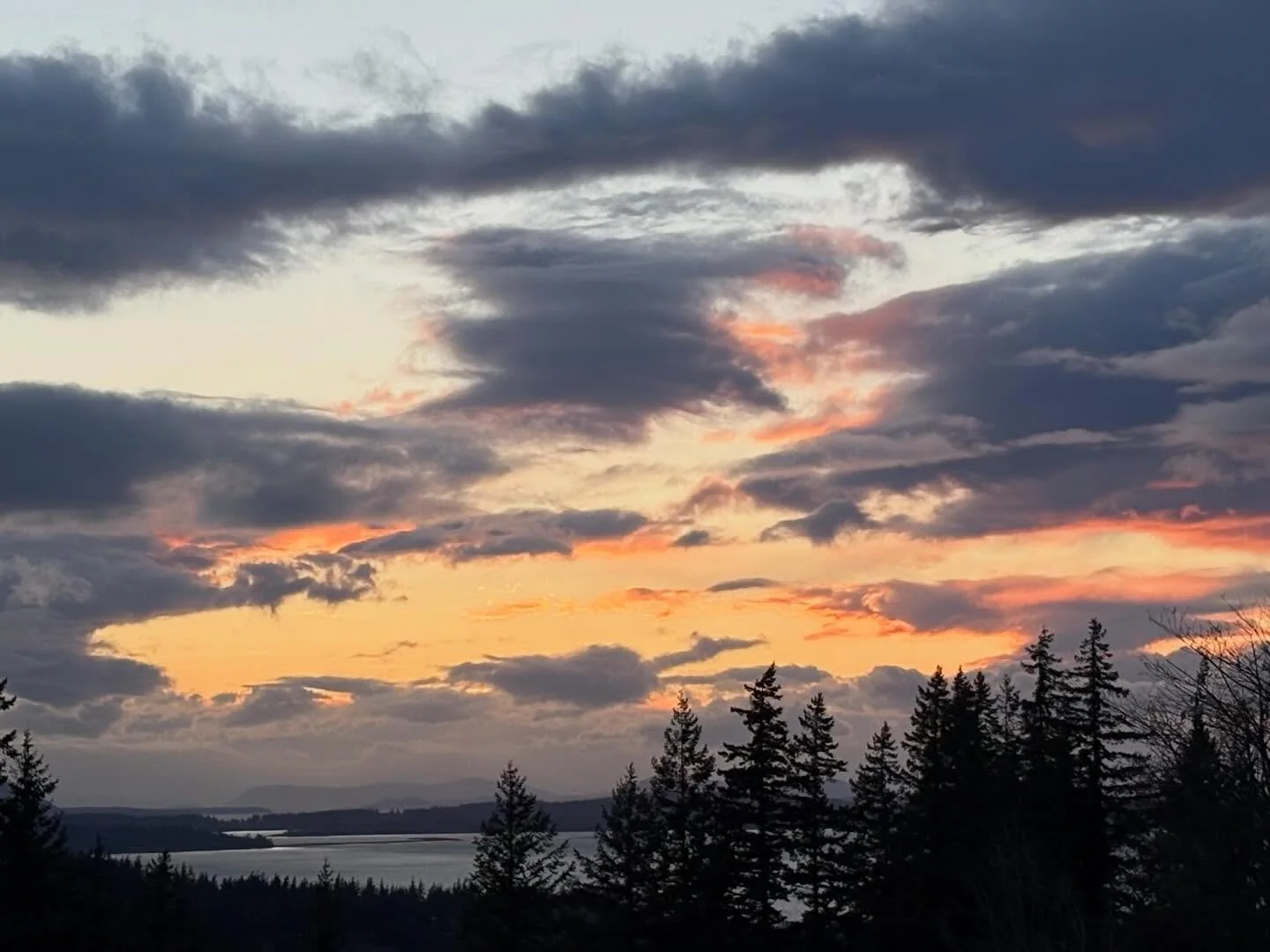 After a very rainy March, some colorful sunsets have returned and Wednesday night (3/25) was a great one! The sun sets directly in front of my view now, which is why spring and fall are my favorite sunset watching seasons! 🌅