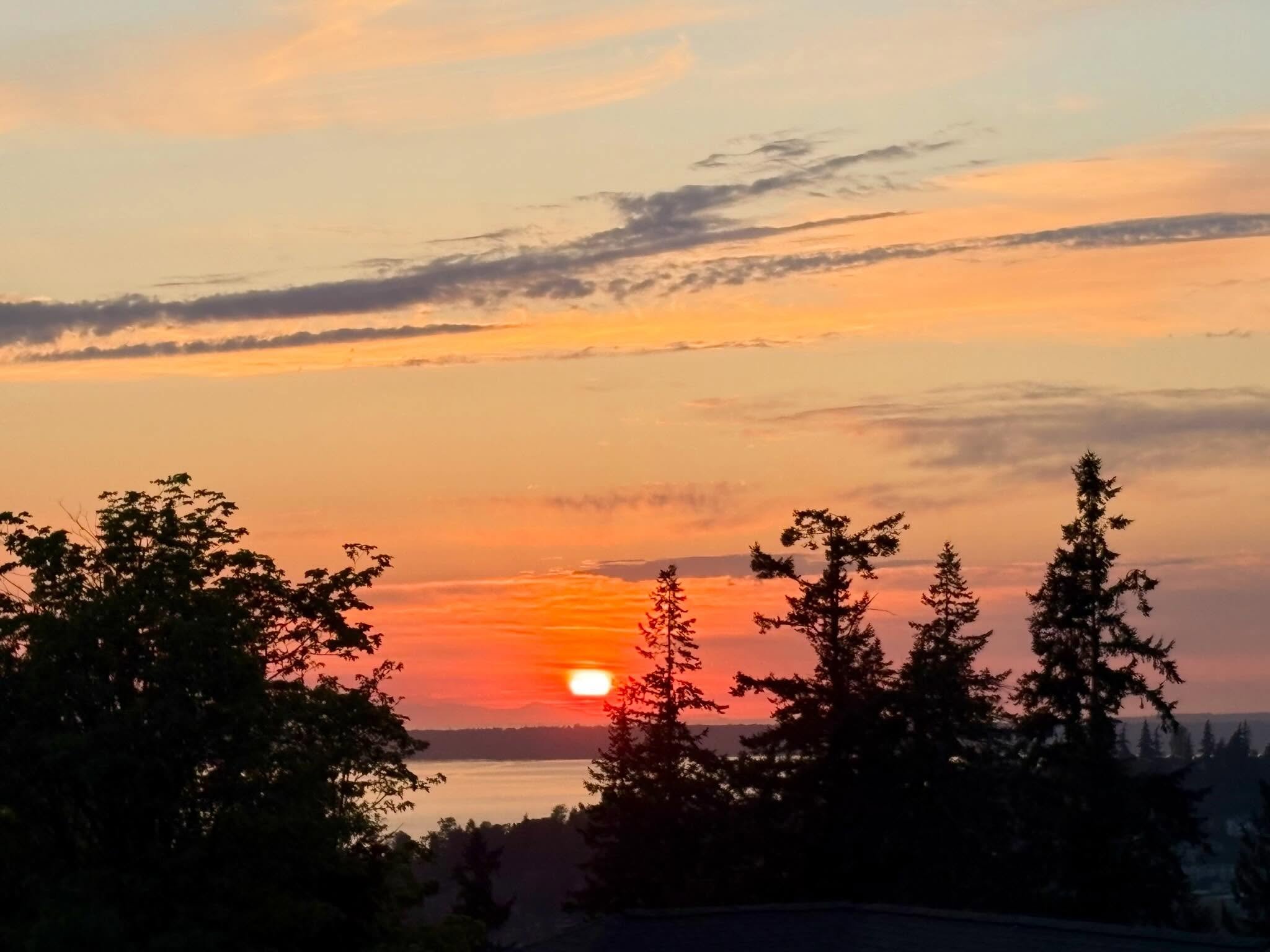 Last night, May started off with one of those sunsets that is better before the sun disappears behind the horizon than after. The rich colors were deepest and brightest during the final decent of the fire ball and then the colors faded fairly quickly