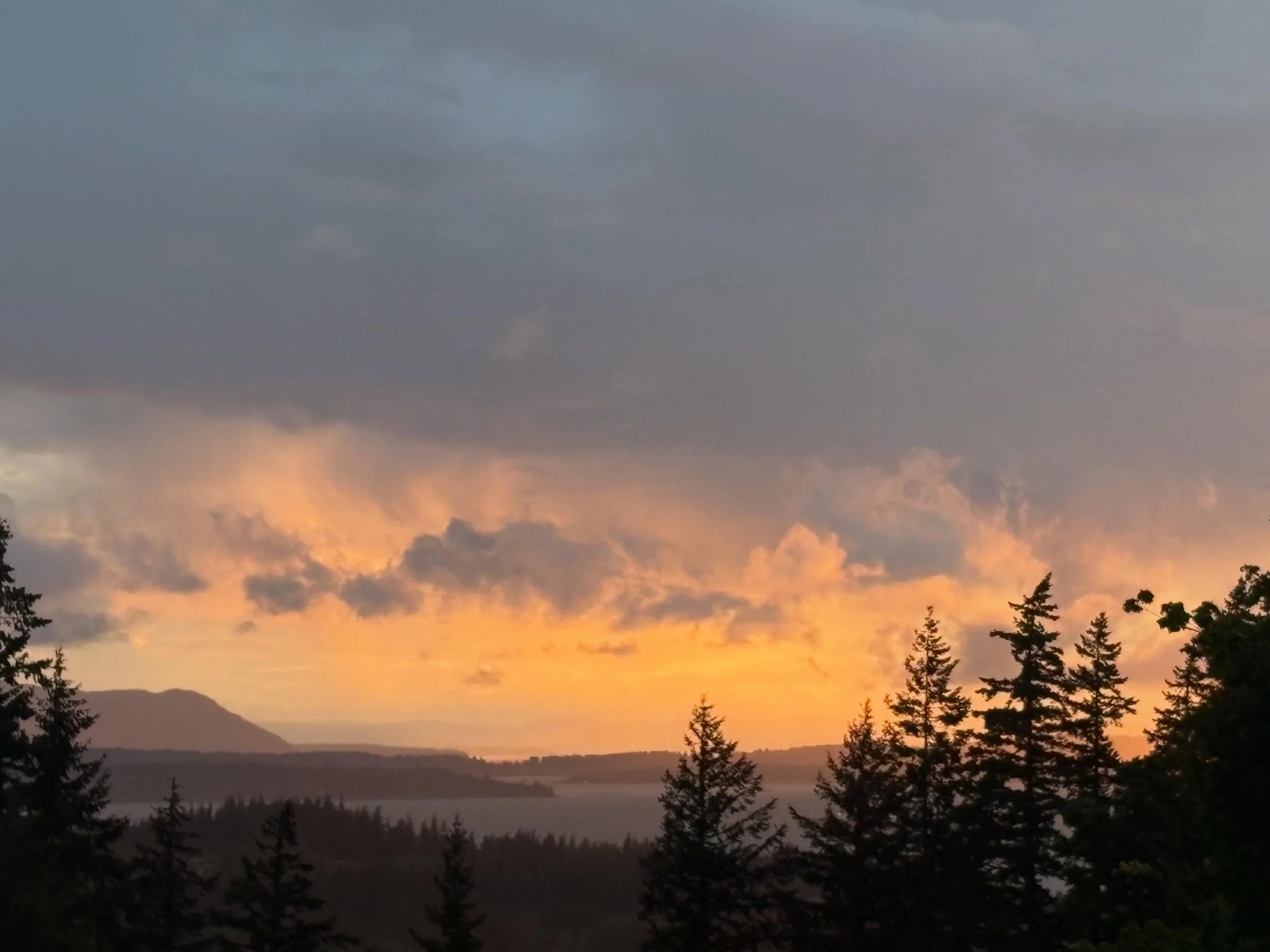 The final part of the sunset from this past Friday (5/15). The thick clouds stayed heavy in the sky as the sunset colors hung over the horizon and filtered through any gaps in the clouds. The colorful display faded slowly until it left only a small a