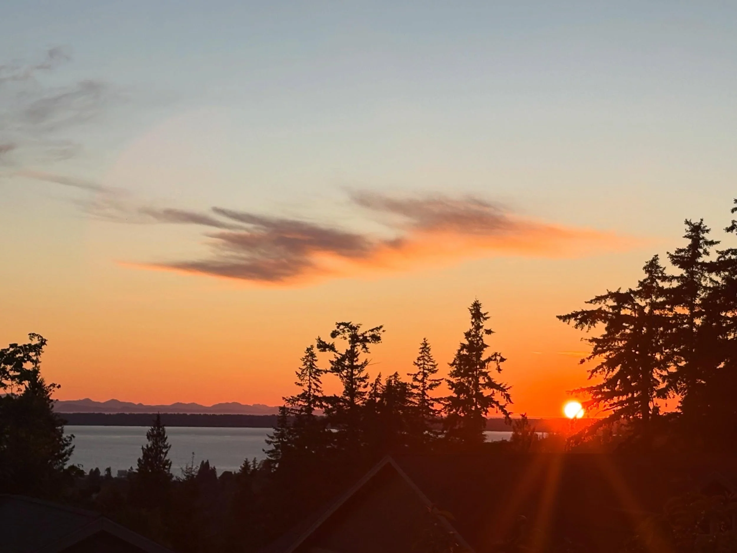 The sunset this past Saturday (5/16) was a good one with the sun setting between the trees and the islands illuminating across the bay. I love seeing the Canadian mountains far in the distance and watching the colors change in the few clouds in the s