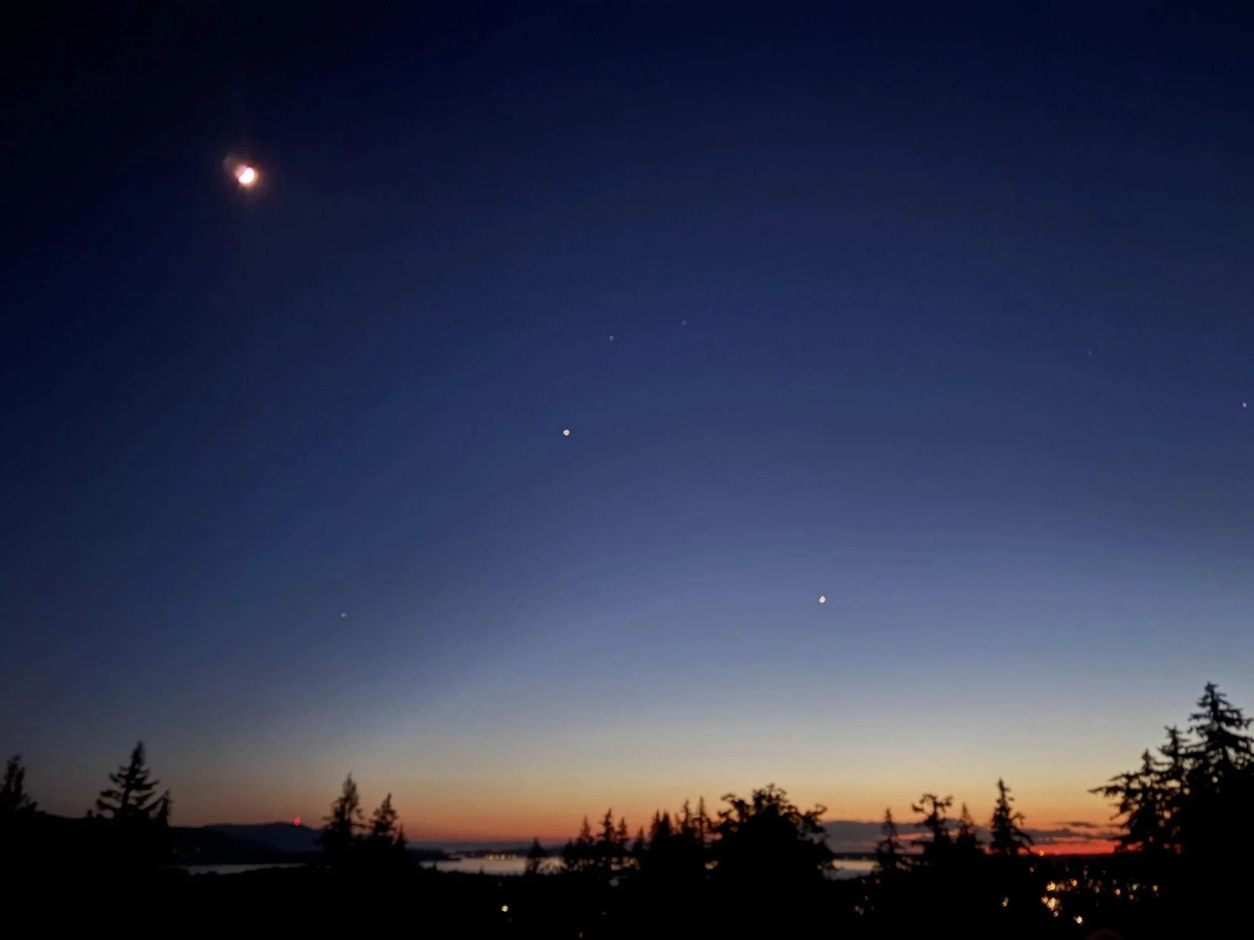 The celestial alignment really came through on Thursday May 21st! You can clearly see the crescent moon, Jupiter, and Venus after the sun went down. The sunset was also a beauty with cloud layers that did a peak-a-boo show with the setting sun, then 