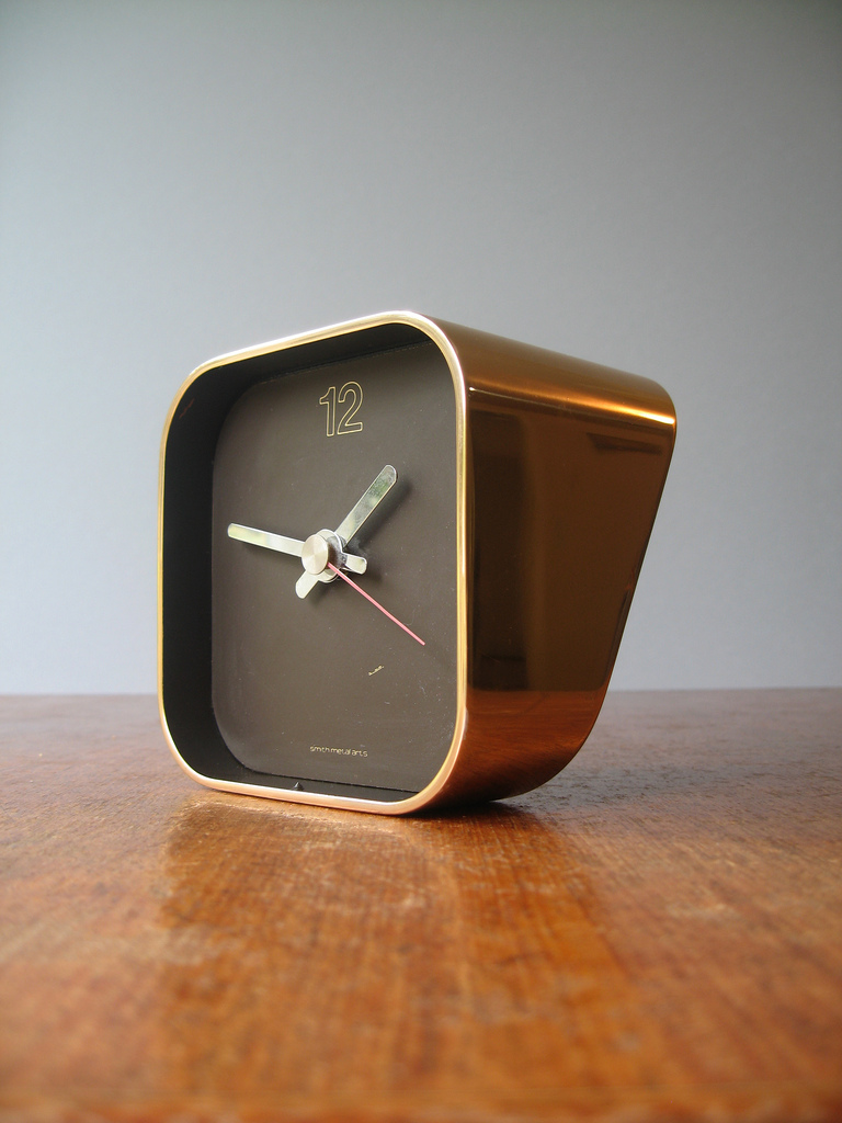 A great estate sale find, this Smith Metal Arts "Radius One" desk clock, designed by William Sklaroff, is still made, but not in solid brass via