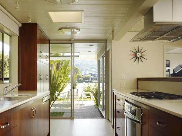 I really like the kitchen remodel, which updates yet retains a sleek mid-century feel.