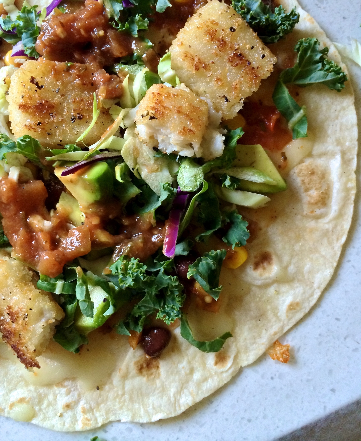 I'm loving tacos these days. They can be an event with homemade salsa and other fillings, or a super-quick lunch thrown together with packaged ingredients, such as this tasty one: Light fish sticks, kale, shaved brussels sprouts, cabbage, corn & black bean salsa, garlic salsa, avocado, a touch of cheese.