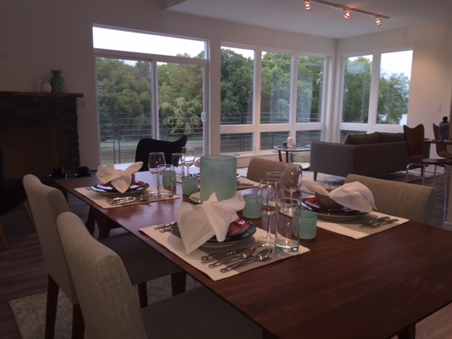 Living, Dining, Kitchen areas are open and lofty with sweeping views to the river.