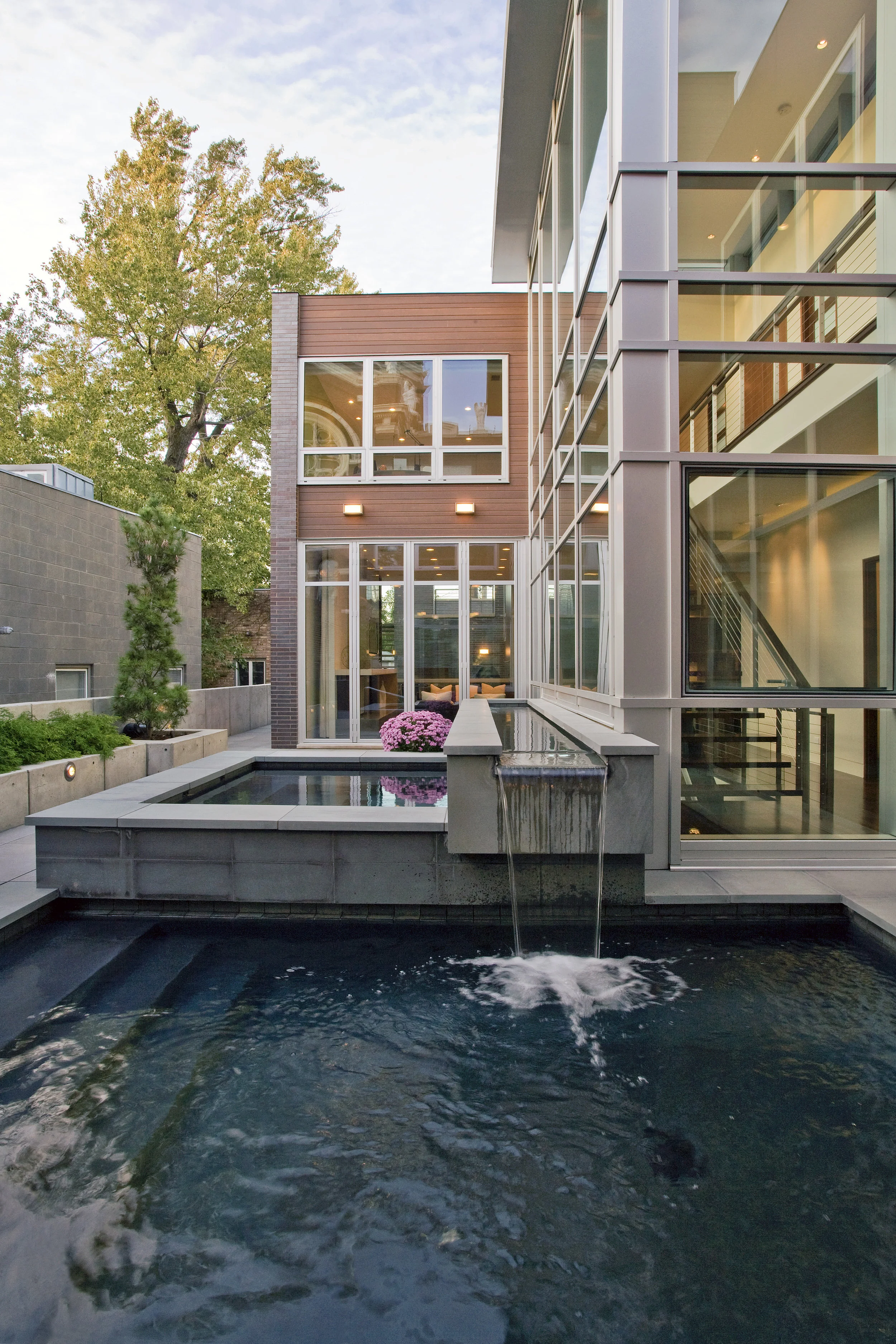 Alignment with the front entrance and incorporation of water elements create clues to what is next in the Cortland Residence