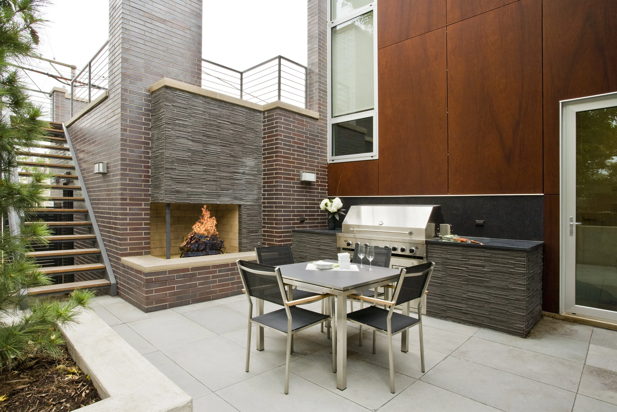 Where water is the theme of one courtyard, fire activates another at the Cortland Residence
