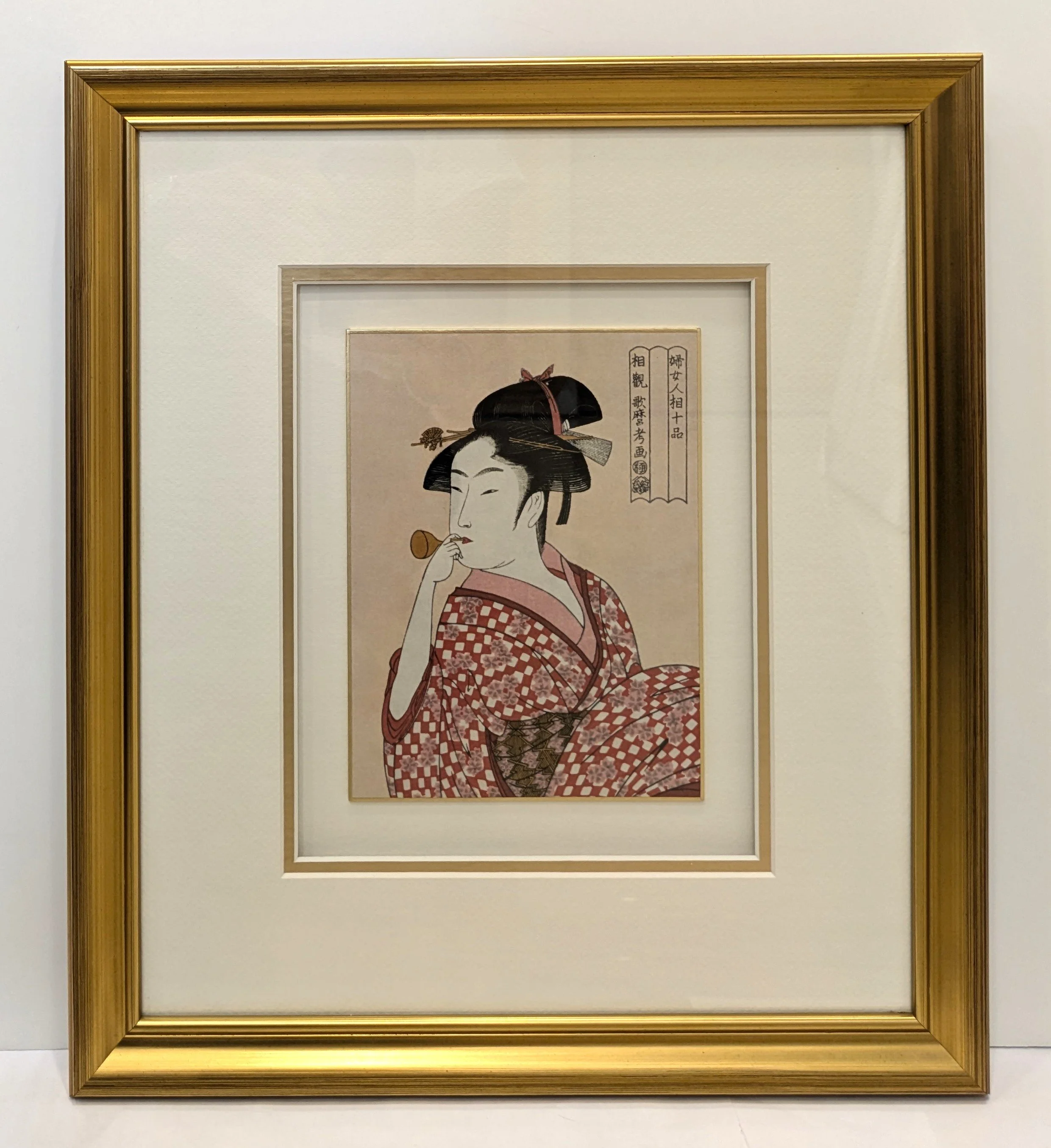 Traditional Japanese woodblock-style print of a woman in a kimono, professionally custom-framed with a gold frame and neutral matboard by Art Reflection Mosman.