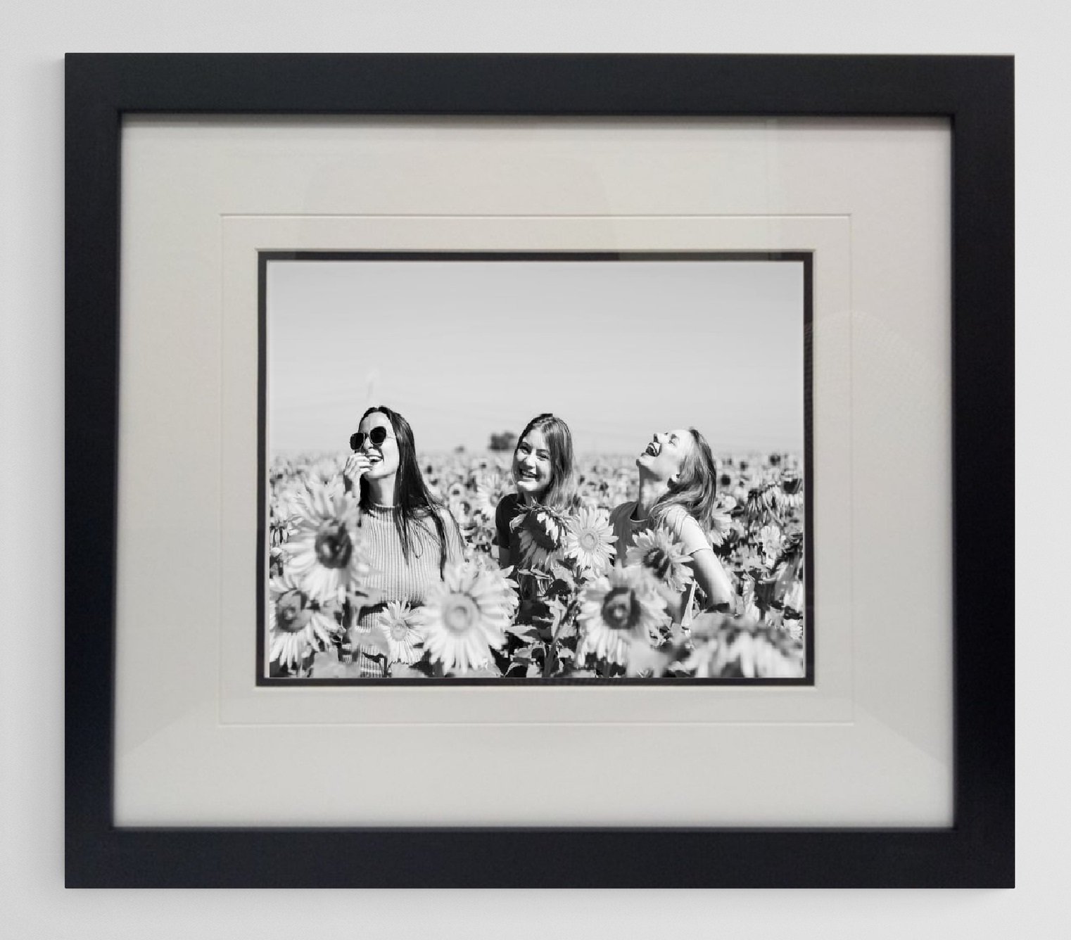 A professional custom-framed black and white photograph featuring a double mat board design with a decorative laser-cut line, crafted at Art Reflection Mosman.
