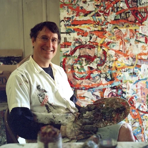 Playwright Tom Block with his paintings.&nbsp;