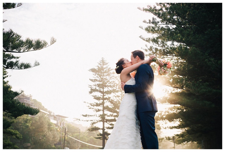 wedding couple kissing sunset palm beach