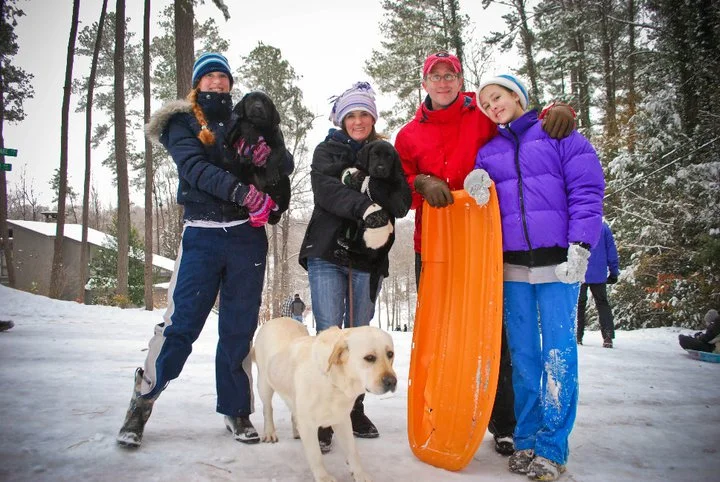 Part of my family at the top of Dead Man's Hill. This was a particularly memorable and snowy year as we got almost 8". However most of what you're seeing is ice.