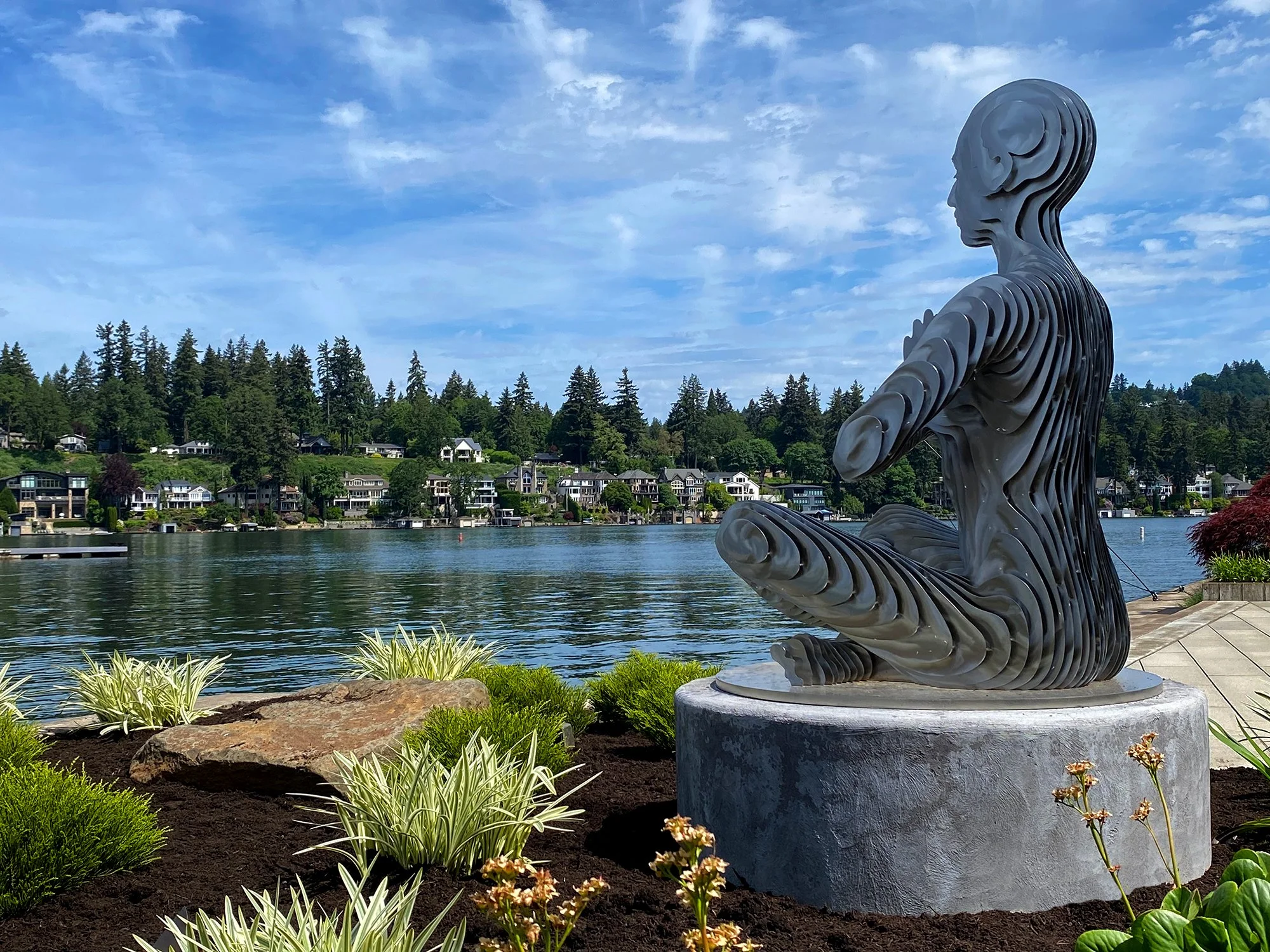 Lake Oswego, Oregon modern landscape design. Fabulous sculpture that disappears as you walk around it. Designed by a Portland artist.
