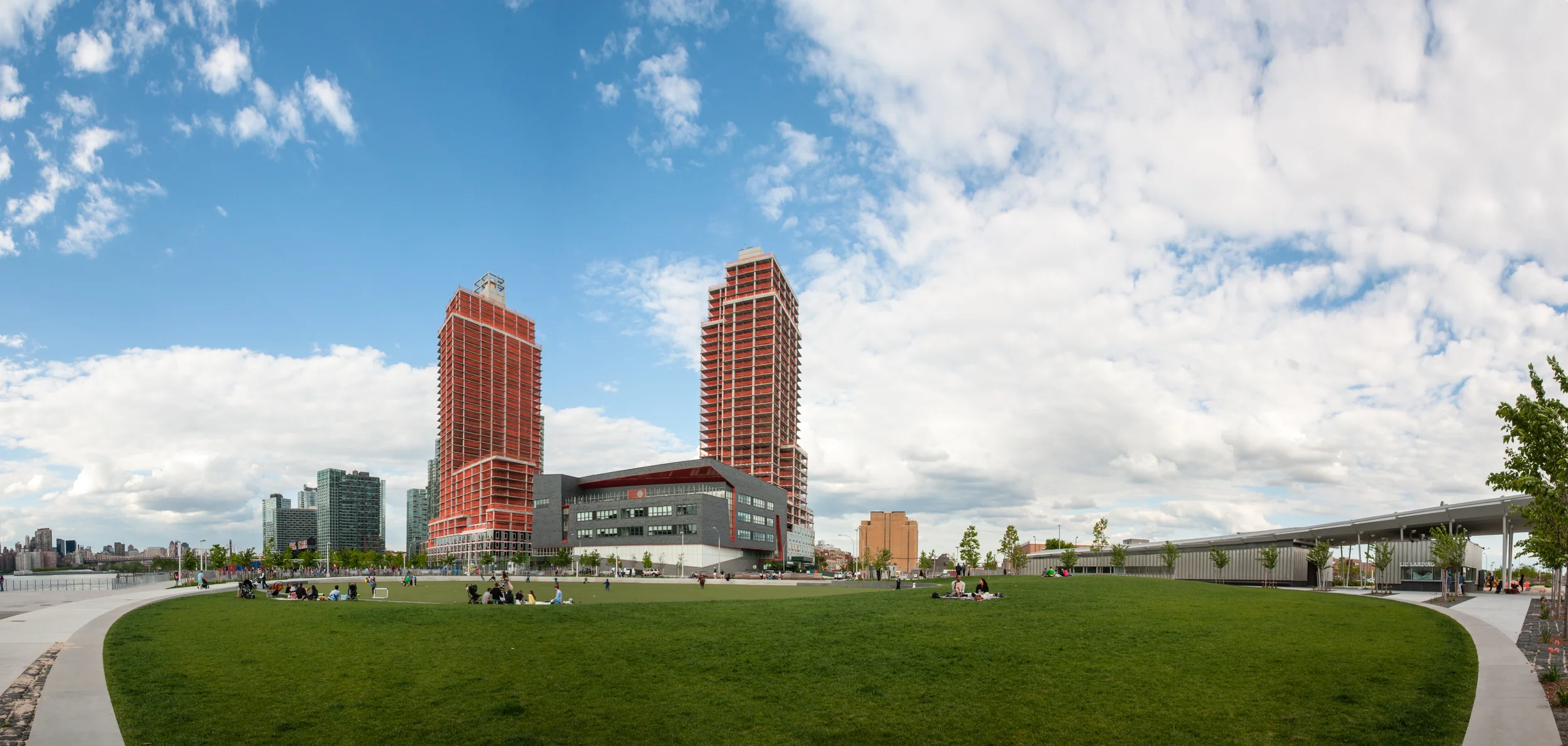 View from the oval green playing field at Hunters Point South Park.
