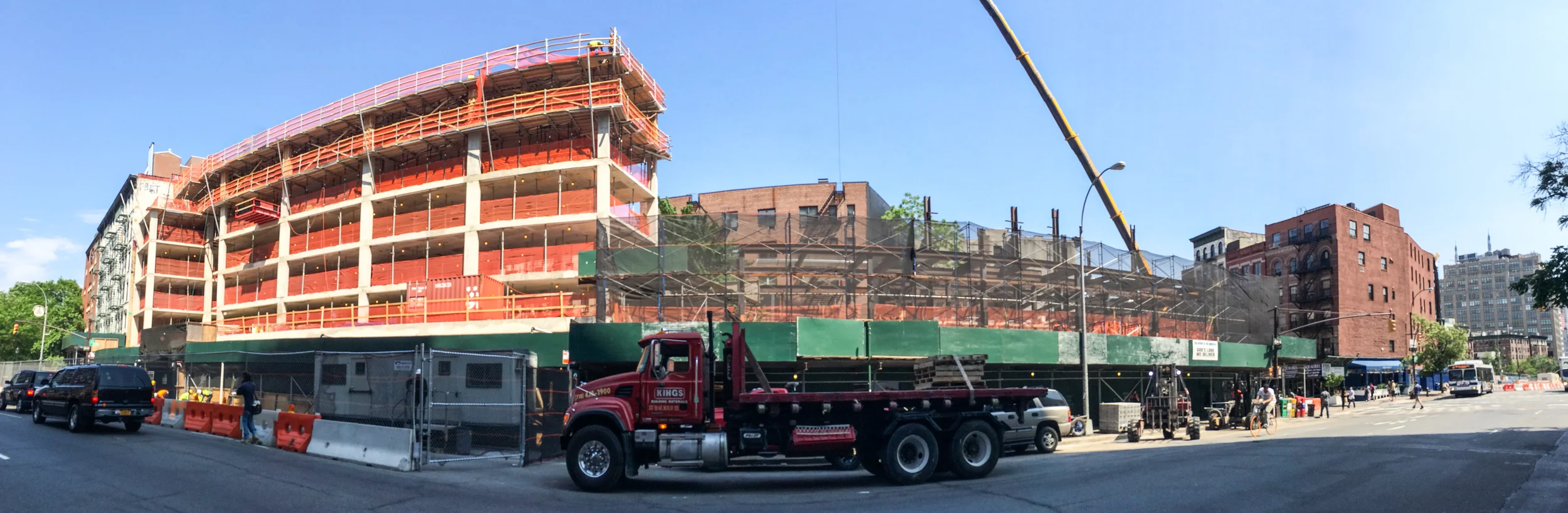 The west facade of One Vandam (left) and the God's Love We Deliver headquarters (right) along Sixth Avenue.