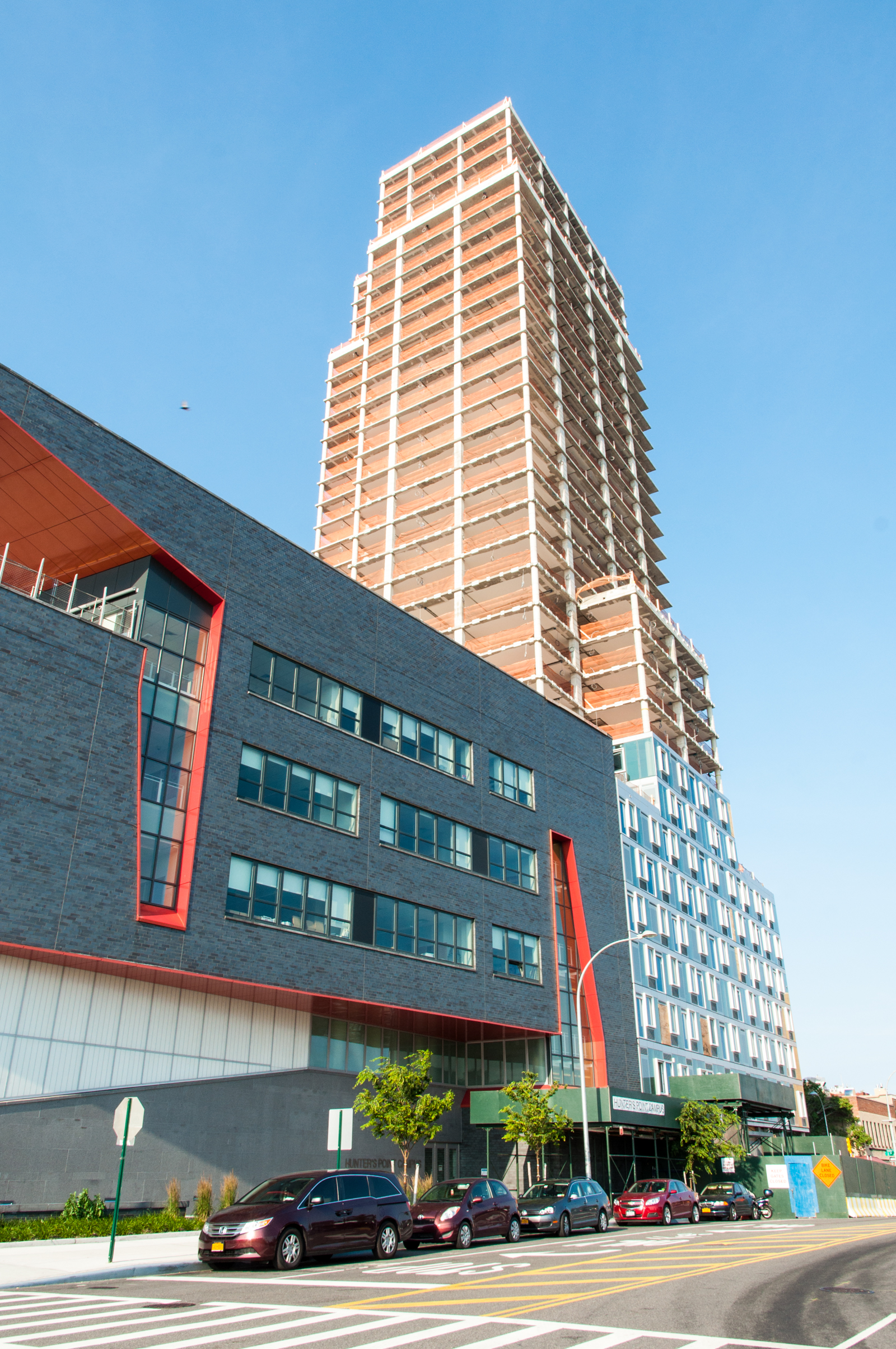 The southwest corner of Building B (right) and the southern facade of the Riverview School (left).