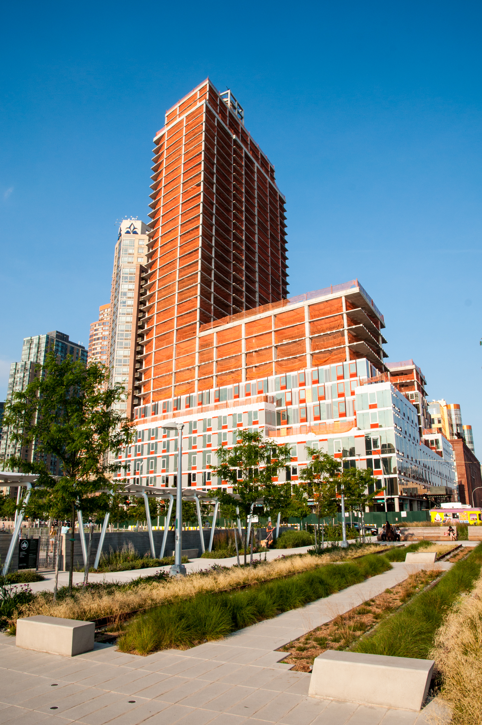 The west facade of Building A from Hunters Point South Park.